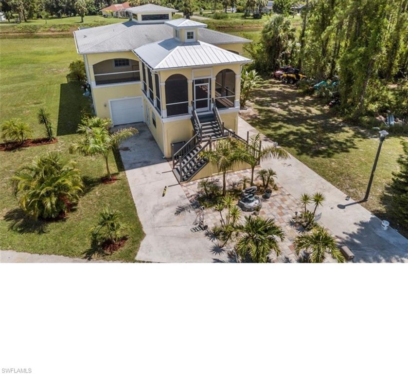 Amazing Stunning Key West styled 2 story Home with many upgrades! offers a beautiful cedar stained vaulted ceiling patio with porcelain tiled plank flooring, that leads into the main entry of this retreat, the open living room floor plan has another vaulted ceiling with transom windows & tiled floors throughout, 8ft. interior doors, eat in kitchen includes stainless steel appliances, breakfast bar New dishwasher & disposal 2020, the Master bedroom suite offers French doors that lead out to your 2 story screened balcony overlooking the pool, Master bath offers a large porcelain tiled walk in shower, tub, & double sink high top Vanity with walk in closets, there is another bedroom on the upper level also, downstairs offers 2 nicely appointed bedrooms, laundry, a full bath, & access out to the New screened private heated salt water pool oasis for all your entertaining 2016, New separate In Law Suite downstairs with tiled floors, full stainless kitchen & full tiled shower bath on its own zone of A/C, the garage has two doors but is 3 cars wide 20 x 40 underneath the house with high ceilings. Electric 2025, New Roof 2024. Not flood Zone.
