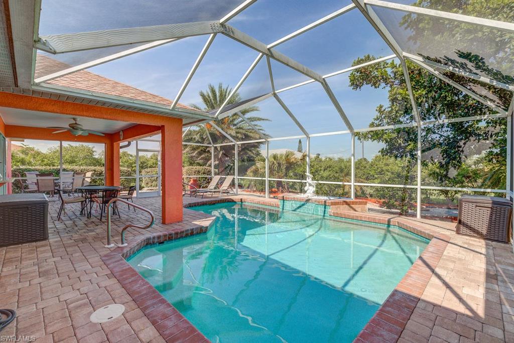 LOTS OF UPGRADES!!! Beautiful 3 bedroom / 2 bath single family pool home in Cape Coral. Open floor plan with tile on the diagonal throughout, updated bathrooms, and low-maintenance yard. The stunning kitchen boasts granite counters, an island with breakfast bar, stainless steel appliances, and pass through window out to the lanai. Master en-suit is fully updated with tiled stand up shower and glass doors. Screened in paved lanai is perfect for entertaining with heated L-shaped saltwater pool, and separate paved area outside of screened enclosure, perfect area for grilling or your fire pit. You don't want to miss out on your piece of PARADISE!!!