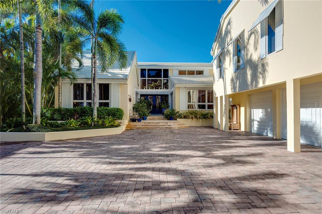 The perfect homesite with charming older home located on prestigious tree-lined Galleon Drive. With a southwest exposure and 100' of water frontage looking over Runaway Bay, this tropical oasis provides a wonderful opportunity to create your own coastal retreat. The improvements and structures on the property are being sold in their "As-Is" condition.