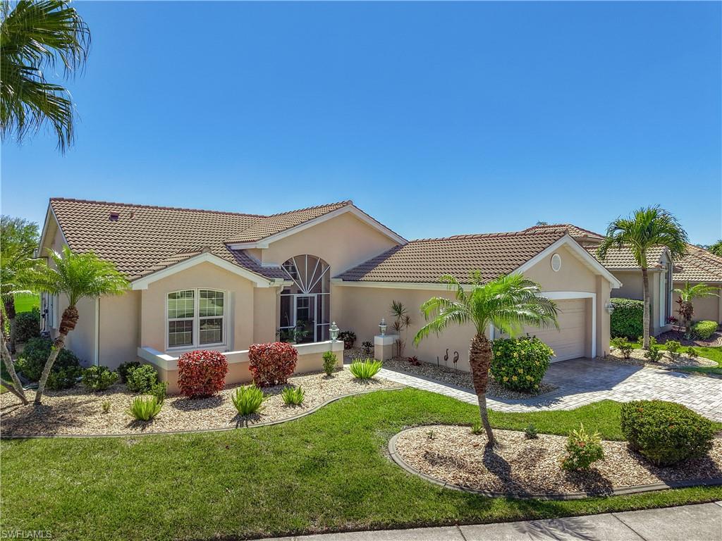 Exceptional south-facing POOL HOME on a quiet cul-de-sac overlooking the first tee of HERONS GLEN COUNTRY CLUB’s Championship Golf Course. This uniquely wonderful property is situated on a pie-shaped lot that is convenient to the front gate and just steps away from the clubhouse, restaurant & lounge, ballroom and activity areas. A paver driveway and tropical landscaping with pebble mulch lead to the screened front loggia. Step inside to find VAULTED CEILINGS, bright freshly painted interiors, PLANTATION SHUTTERS and new blinds throughout, giving every room a crisp, polished feel. You will love the large TILE FLOOR THROUGHOUT the home and the big IMPACT GLASS WINDOWS that make the home sunny, quiet, and safe. The kitchen impresses with lots of UPGRADED CABINETRY with chunky CROWN MOLDING, granite countertops, tile backsplash, an eat-in area, and a 2026 new stainless steel refrigerator… functional and beautiful. The primary suite offers a RENOVATED MASTER BATHROOM with a large walk-in shower with FRAMELESS GLASS, spacious vanity with dual sinks, and a generous walk-in closet. There is a sunny guest room, and a DEN that features a Murphy bed so it can function as an additional private guest space whenever you need one. The laundry room is equally well equipped, with full size stackable units, built in storage, a desk, and a utility sink. Outside, the pool and spa sparkle all day in the sunshine. The pavered lanai has plenty of covered and uncovered deck spaces, perfect for quietly contemplating golfers’ swings, or entertaining a group of friends.  The pool is heated with 2020 SOLAR PANELS, and a 2025 pool pump keeps everything running smoothly. A BURIED PROPANE TANK provides the option to add a gas stove or other gas appliances down the road. The roof, AC, water heater, and smart smoke detectors have all been updated in recent years, and the home is being sold TURNKEY, so you can jump in and begin enjoying the many amenities and activities that make Herons Glen a truly special place to live. This is more than a home, it's your gateway to the Florida resort lifestyle. Schedule your private tour today.