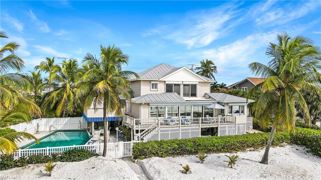 There are a very few remaining Olde Florida style Gulf-front cottages featuring 4,112 sq ft and 4 bedrooms 4 1/2 baths on the island – especially with the presence and timeless character of this classic. Situated on a 100 ft. WIDE lot, this impressive property is located on one of the largest single family home parcels on the island-giving wide, panoramic views of the Gulf.  An exceptionally large 40' Long Gulf-front pool is located on the side of the home with spacious outdoor lounging and entertainment areas.  The kitchen/breakfast nook, dining, master bedroom suite and main living areas are all impressively spacious and open, complimented by a family and guest friendly floor plan.  The master suite offers an immense walk-in closet with built-in cabinets.  The kitchen countertops and flooring are granite, as well as the master bath countertops.  Enjoy the sound of the surf with your morning coffee and the beauty of the evening sunset from the elevated Gulf-front deck and a relaxing day on your beach in between!  This is the perfect home to make your own.  Schedule your showing today and enjoy a visit with this unique and impressive cottage.
