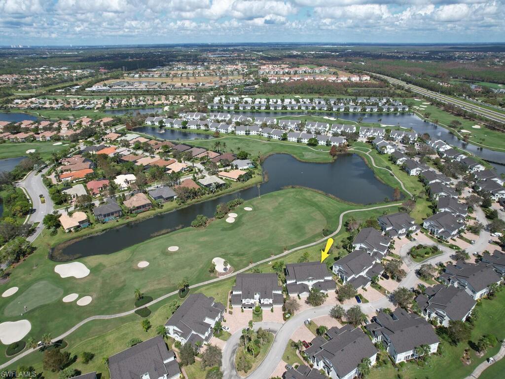New to the market - this light and bright spacious second floor condo with expansive views of the gulf course in the much sought after Clubside at The Strand, a gated golf course and tennis community designed by renowned architect Gordon Lewis in North Naples, is ready for you! This end unit coach home has a two car attached garage, private elevator, electric storm shutters and is fully furnished. Enjoy watching the golfers from the large screened balcony with built-in grill, living room and eat-in breakfast area.  The primary suite includes a walk-in closet, dual sinks and walk in shower. The Club at the Strand, a private club offers 27 championship golf holes,  Tennis Center & recently renovated Fitness Complex with state-of-the-art fitness equipment, 8 Har-Tru clay tennis courts and recently added 3 Pickleball courts, Bocce courts, a heated Jr. Olympic pool and Day Spa. Members enjoy casual and fine dining too! 30 minutes to the International Airport. Minutes from Gulf of Mexico beaches, the most popular North Collier Regional Park, shopping, dining, museums, galleries and entertainment! Ask about club memberships details and special financing options!