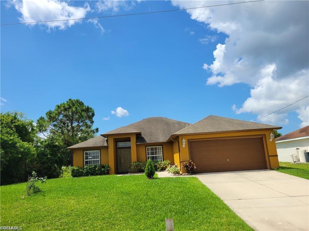 Elegant 4-Bedroom Home - This is a beautifully updated home in the desirable SW section of Lehigh Acres. This home offers an inviting blend of sophistication and comfort, with modern finishes that make it truly stand out including newly updated bathrooms. Enjoy spacious, sunlit interiors, a thoughtfully designed layout, and move-in-ready convenience.  Relax 0n the oversized screened lanai or soak up some Florida sunshine in the spacious backyard. Jet Blue major league ball park is only 16 minutes away, this community has something for everyone., you're just minutes from shopping, dining, and entertainment. Don't miss this opportunity—schedule your private tour today!