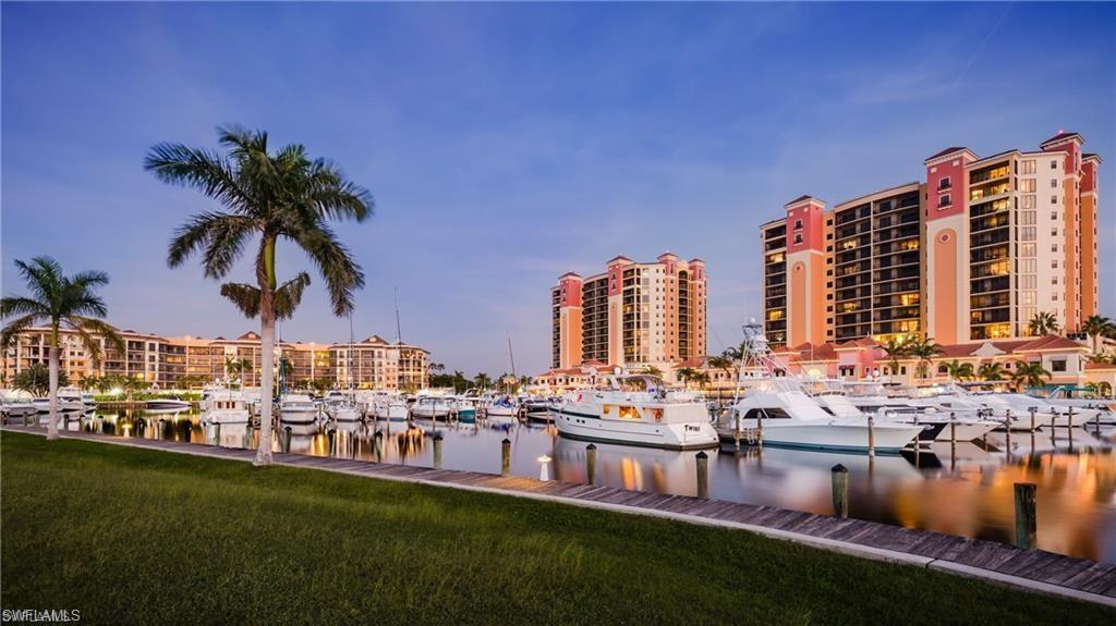 ARE YOU LOOKING FOR VIEWS THAT OVERLOOK THE WATERWAY TO SANIBEL ISLAND OR A SPECTACULAR MARINA?? LOOK NO FURTHUR - THIS CONDO HAS THE BEST OF BOTH WORLDS WITH VIEWS OF BOTH FROM THE BACK LANAI. Welcome to Cape Harbour, a luxury condo/boating community where spectacular views and lavish waterfront living are waiting for you. This luxury condominium community offers 3 restaurants, ice cream/coffee shop, and 2 out side bars offering live music, boutiques and art galleries, enjoy a day at the clubhouse offering a heated pool, fitness room, tennis, basketball and a playground for the kids.  This condo is impeccable, Crown molding in the living and bedroom areas, TILE FLOORS throughout the entire condo even on the lanai, granite counters and tile back splash in the gourmet kitchen, wood cabinetry and large sink, Beautiful custom window coverings with Levolor Blinds, tastefully decorated, spacious bedrooms and bathrooms but best of all...The views over looking the water and Marina are absolutely beautiful not to mention the most breath taking sunsets. This condo is being offered TURNKEY so it literally needs nothing but you!!! Don't Miss out, schedule your private showing today.