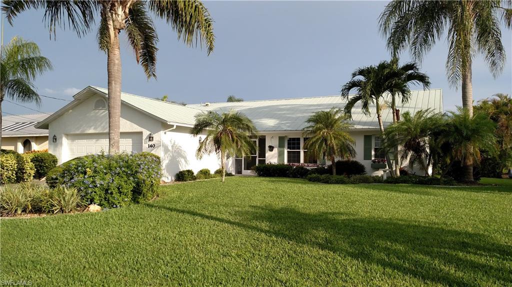 Talk About Florida Living at its Finest! This Immaculately and Meticulously Maintained, Gulf Access, Three Bedroom, Two Bath Home HAS IT ALL!!!  This House Has Wonderful Curb Appeal. From the Inviting Entry Foyer to the Formal Dining Room As Well As Large Kitchen/Dinette Area to the Over Sized Lanai and Pool Area to the  Dock w/10K Boat Lift and 2x6 Trex Composite Decking, This House Has Everything. The Property Features A Newly Updated Kitchen with Granite Counter Tops, Updated Bathrooms, NEW Core Tec Waterproof Engineered Plank Flooring and 5-1/4" Baseboard Molding Throughout, Volume Ceilings in the Living Room, Hurricane Rated, High R Double Hung Windows, Hurricane Shutters for the Sliding and French Doors, A Metal Roof, Hurricane Rated Garage Door and Newer A/C (2012). Both Interior and Exterior Have Been Recently Painted. The South Exposure Pool Area is Spacious and Ideal for Entertaining. This House is a Boater's Dream Come True, with a Short Transit time to the River and Gulf. It is also Close to Shopping, Cape Coral Pkwy and Veteran's Pkwy and Ft Myers Beaches. Call for Your Showing Appointment Today and You Too Can Be Part of the Florida Dream.