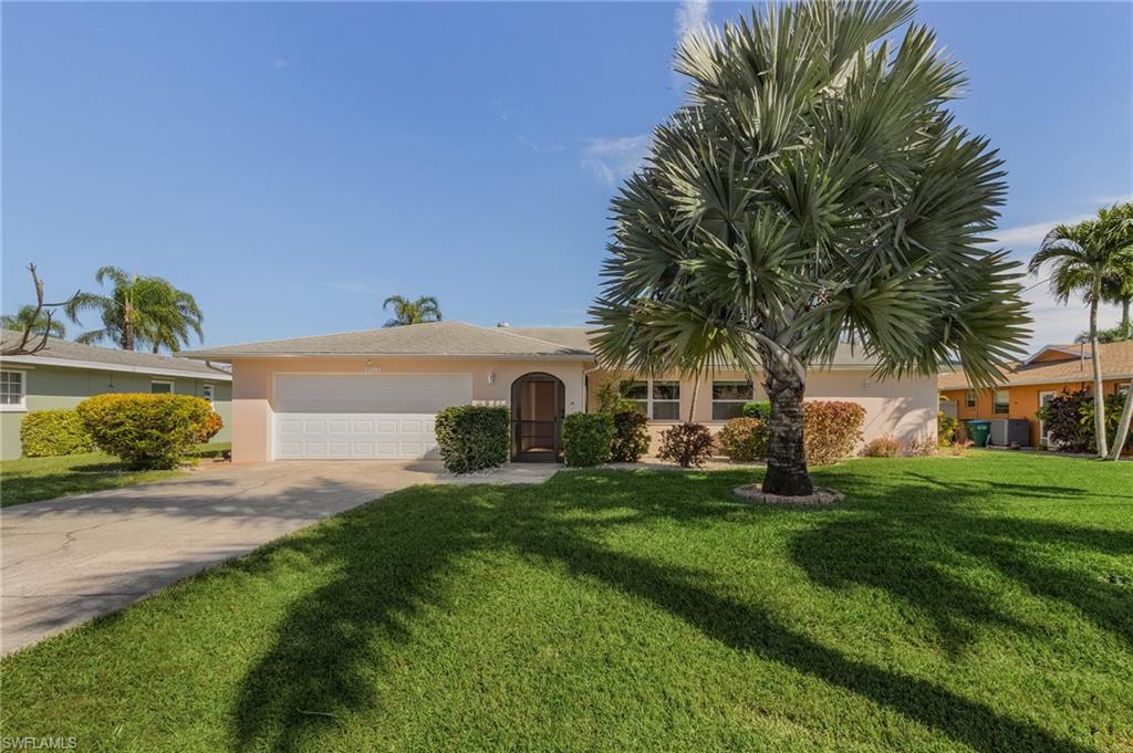 Direct Gulf Access pool home located in the West Yacht Club area.  This home is perfect for entertaining Southwest Florida style with a modern kitchen and numerous upgrades. Spacious living room, family room with formal dining, tile floors throughout, lovely kitchen with granite counters, breakfast bar, Whirlpool stainless appliances and shaker style cabinets with soft close doors and drawers. Siding pocket doors open the home right up to the large solar heated pool and huge screened lanai.  Pass-through window from kitchen and wet bar on patio make entertaining a breeze.  Garage has epoxy floor, work counter, cabinets, and plenty of storage space. AstroGuard (fabric style) hurricane protection for all windows.  Water and electric available at dock.  10k lbs. boat lift.  Mature landscaping with royal and silver palms, fruit producing avocado and banana trees.  ALL ASSESSMENTS PAID.  Perfect neighborhood for sunset walks.  Close to restaurants, parks, grocery store, shops and more.  Move in ready condition!  Schedule your private showing today!   Only 10 minutes to the Caloosahatchee River and 7.1 miles to the Sanibel Causeway and Gulf of Mexico.