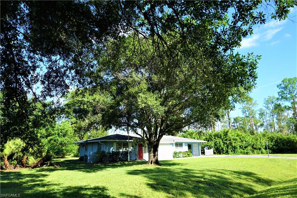 Super Nice, Move-In Ready 3 Bedroom 2 Bath home with attached carport that sits on nearly a half acre parcel offering optimum privacy.  Long Driveway with plenty of parking, the covered carport has access into the home through the indoor laundry which also has extra room for storage. The Kitchen is fully functional with plenty of counter space, pantry, and cabinets. Split Bedroom Floor-plan with Living / Dining area that has sliders leading out to the screened porch. Master Bedroom is bright and airy with it's own en-suite bathroom with stand up shower. Bedrooms 2 and 3 are a good size with ample closet space and share Guest bath with tub shower combo. This home has been well maintained over the years and the interior was just freshly painted. The Terazzo floor throughout was just cleaned and sealed, there is a newer water system, the well pump is less than one year old.    Lots of room to spread out and breathe, with the .49 acre of land you could put in a pool and have a nice garden.  Schedule your showing today, this house won't be on the market long.