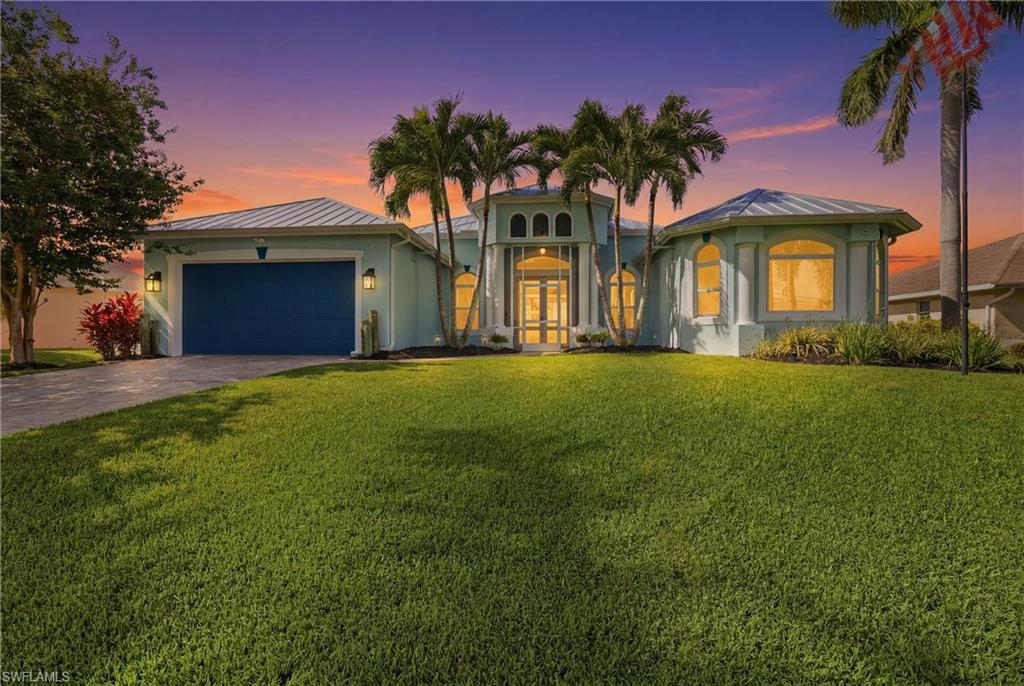 Imagine ending each day with golden sunsets reflecting across your sparkling pool, gathering with friends on the expansive porcelain-tiled lanai, and waking up knowing you've found the Florida lifestyle you've always dreamed about.  Nestled in one of Southwest Cape Coral's most desirable neighborhoods, this beautifully updated home offers the perfect blend of comfort, elegance, and peace of mind. With over 2,200 square feet of thoughtfully designed living space, you'll find 3 spacious bedrooms plus a versatile den that easily adapts to your lifestyle—whether you need a home office, gym, or guest space.  Inside, soaring ceilings, light-filled living areas and elegant finishes create an inviting atmosphere that instantly feels like home. The open layout was made for entertaining, while the seamless transition to the south-facing outdoor oasis makes every day feel like a vacation. Recently enhanced with a resurfaced pool and stunning porcelain tile decking, the backyard is truly the showstopper—a private retreat where memories are made and relaxation comes naturally.  Beyond its beauty, this home offers something increasingly hard to find: confidence. Featuring a new metal roof, new AC, remodeled kitchen, situated on an elevated lot and featuring impact-resistant windows and doors; this meticulously maintained residence has never flooded, allowing you to enjoy everything Southwest Florida has to offer with added peace of mind.  Just minutes from Cape Harbour, waterfront dining, shopping, parks, and some of the area's best boating and beaches, this is more than a home—it's a lifestyle.  Homes that combine location, updates, and outdoor living this beautifully are becoming increasingly rare. Come experience why so many buyers are falling in love with Southwest Cape Coral, and discover what it feels like to finally come home.
