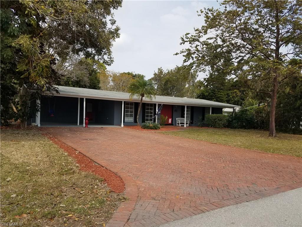 Totally remodeled and nothing to do !! New flooring throughout. Awesome layout and a HUGE corner lot. New interior and exterior paint. Brand New Water Heater!! Gorgeous kitchen with granite counters including large breakfast bar, wood cabinets, mosaic glass tile backsplash, stainless appliances and recessed lighting!! Updated bathrooms with marble accents and custom tile shelves. Master bath has a rainfall shower head with changing LED lights. Large baseboards throughout the home. Private fenced courtyard area. Outside storage area. Beautiful brick paver driveway leading up to a large 2 car carport. Great size laundry in the home just off the kitchen. Open layout with a split bedroom plan. A/C is just over a year old. Walking distance to Jefferson Park and super close to Fort Myers River District and Ft Myers Country Club.