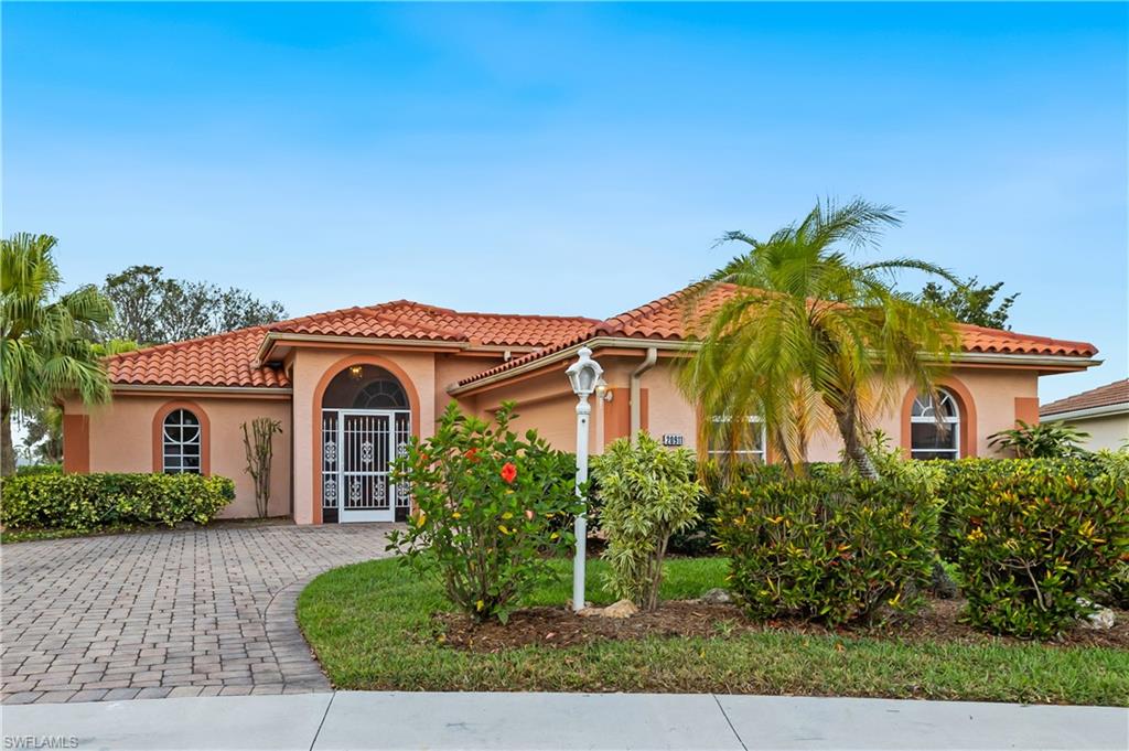 Popular Herons Glen community has another gem available.  This LeScala floorplan has vaulted ceilings for the open feel & is flooded with natural light.  The home is positioned on the lot to take advantage of privacy and a view of lush garden beds & pond. This model is rare because of the oversized driveway and side load garage. Garage has large mats which can be removed for easy cleaning, it also has many cabinets & work space. ROOF new 2020, Hot Water Htr 2019, HVAC system with air scrubber & air purifier 2022.  Granite counter tops in kitchen & both bathrms. Updated kitchen has nice pantry & sliding door to patio it also has a pocket door for privacy if needed. Front has etched glass door & side panels for morning light.  Follow to open dining to great room then flow into sun drenched Florida room ready for your touch. Perfect for den or sitting room. Primary bedroom has updated bath & custom walkin closet. This home is move in ready.  Herons Glen is one of the most sought after communities with golf course, restaurant, ballroom, pool, gym, pickleball & tennis too many amenities to mention.  Call today for your private tour.