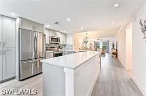Princeton Place of Wiggins Bay is located west of US 41 just minutes to Wiggins Delnor State Park. Cute and Charming Beach Bungalow with southern exposure in the gated community of Wiggins Bay. This 1st floor luxury condo features an open concept floor plan that has been completely renovated from front door to rear lanai featuring 2 bedrooms (king bed & queen size beds), 2 baths with a gourmet eat-in kitchen, spacious great room, dining room, and a screened in lanai overlooking the pool. Literally walk out your screened door and jump in! Enjoy the peaceful and serene views of the lake and community pool from the screened lanai. This condo is turnkey furnished with all linens, towels, beach chairs and includes wi-fi and a washer and dryer are in the unit. For an additional transfer fee, membership to the exclusive Tarpon Cove Yacht & Racquet Club is provided which features casual and fine dining, 6 Har-Tru tennis courts, fitness center, tropical style pool & tiki bar and private beach access complete with a 46' passenger pontoon boat that ferries you to the Delnor-Wiggins State Park