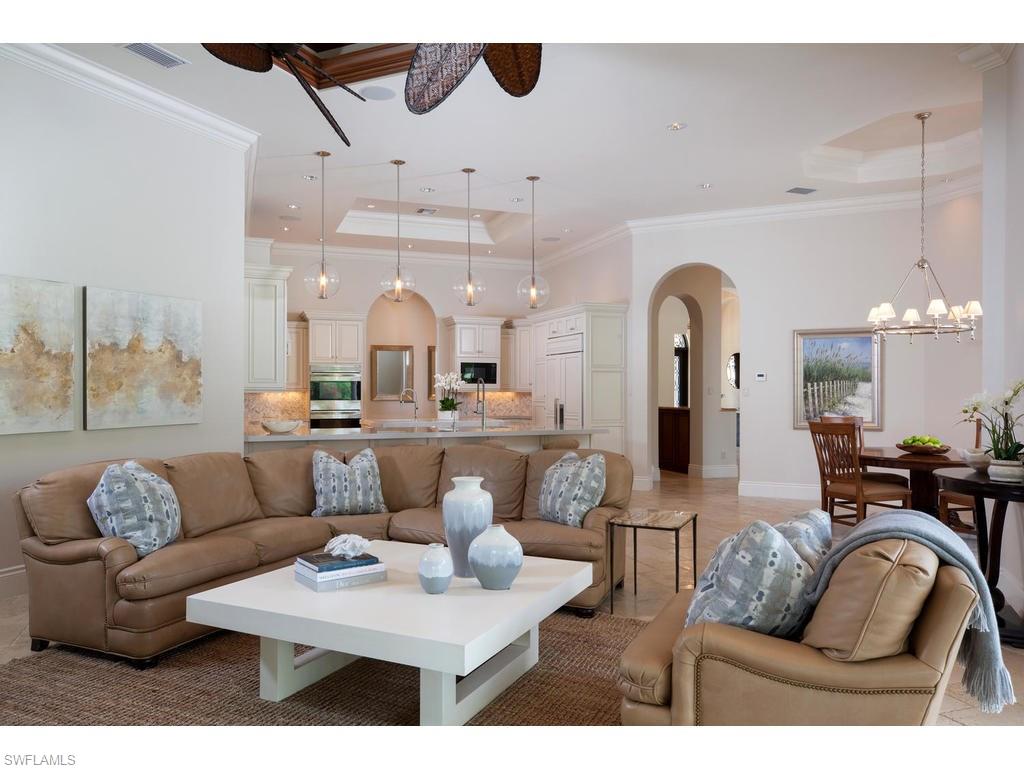 Exquisite custom-built estate home in the highly sought after community of Pine Ridge Estates. This home has recently had new designer touches to enhance its true beauty.  This home is a 5-time Sand Dollar Award winner, and is situated on a park-like 1.65 acres, with lush landscaping. This stunning home features 5 bedrooms, 5 1/2 baths, 5335 sq. ft. under air, living room, family room, office, play room, 5th bedroom that can also be used as a bonus room, Control 4 Smart-Home Technology, gourmet kitchen with top of the line appliances and center island w/prep sink, in-door bar with wine cooler and sink, 2 natural stone fireplaces, and a stunning stone fountain in the circular driveway will welcome you home. The expansive lanai offers 1,515 sq. ft. of entertaining space, beautiful custom pool, spa, and waterslide, fully equipped out-door kitchen and bar with built in grill, ice maker, refrigerator, and sink. This home is fully gated and fenced, and boasts a whole-home generator, impact glass throughout, electric hurricane shutters on the lanai, and a half basketball court. This home has all of the upgrades, and will exceed your expectations!