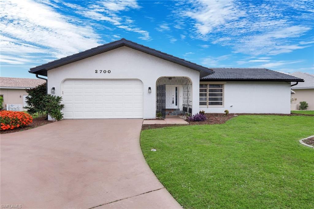 Experience the ultimate Florida lifestyle in this beautiful 3-bedroom, 2-bathroom DIRECT GULF ACCESS retreat. BRAND NEW AC! Beautifully remodeled in 2018. Newer kitchen, flooring and baths. Located in the pristine, stunning Punta Gorda Isles neighborhood, where sailboats and marinas are all around. Designed for the serious boater, this home offers bridge-free, direct Gulf access right from your private dock. Enjoy an oversized corner lot with western exposure over the rear for beautiful sunsets over the water. There is plenty of room for a pool. No rental restrictions can allow for a perfect investment for short and long term renters. Inside, an expansive open floor plan connects a recently updated kitchen—complete with modern finishes and sleek countertops—to a sun-drenched living area. The split-bedroom layout ensures maximum privacy, featuring a primary suite with a dual-sink vanity and a spacious walk-in closet. Recent upgrades include brand-new flooring throughout, 6" seamless gutters, soffits and fascia...a freshly screened lanai, and a professionally sealed concrete tile roof. No assessments owed, and zero flooding from past hurricanes. Strong tile roof w zero leaks. Your private coastal sanctuary awaits. Walk to shops, restaurants and even the Isles Yacht Club. Absolutely stunning location. Extremely close to Fishermans Village.
