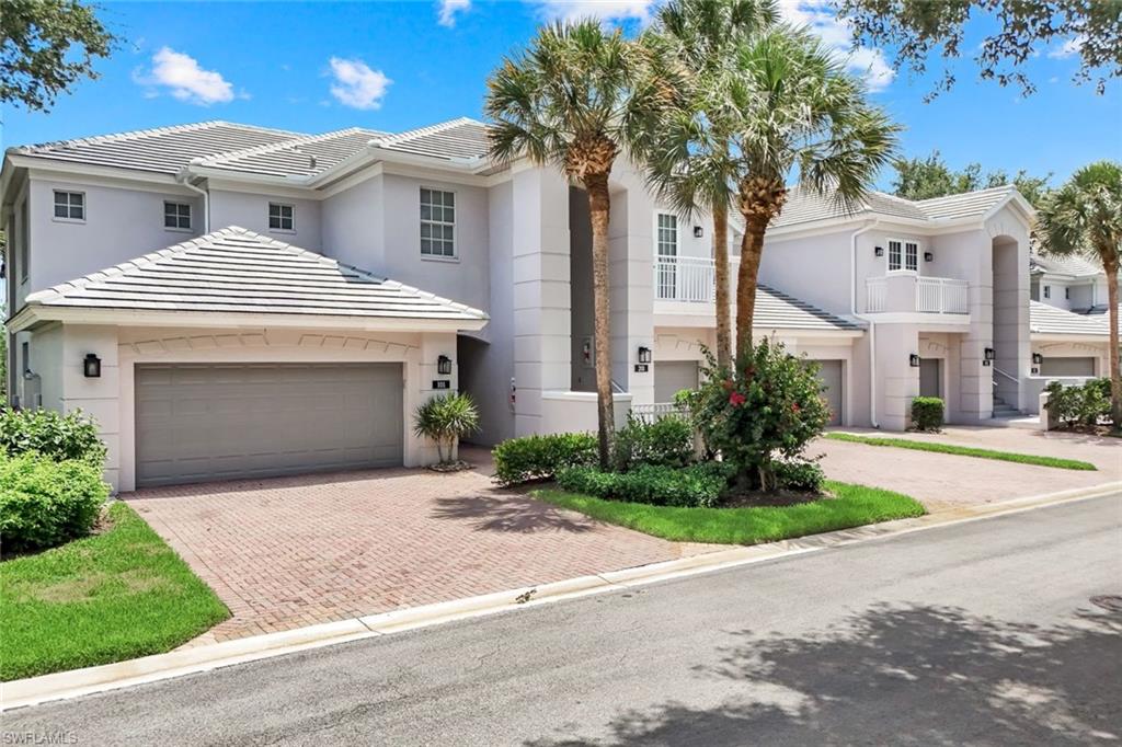 Experience the best of Southwest Florida living from this impeccably appointed First-floor end residence with a 2-Car Garage perfectly positioned to capture coveted southern exposure and breathtaking southern exposure lake and golf course vistas within the prestigious private location of Indigo Isle. This low density street is a one sided street with the most beautiful golf course and lake views and is offered Turn-key Furnished. 

Designed for both comfort and elegance, this spacious residence features three bedrooms, two-and-a-half baths, a private guest en-suite, and an oversized two-car garage. The gourmet kitchen is a showpiece, offering granite countertops, designer tile backsplash, custom 42-inch cabinetry with under-cabinet lighting, a built-in wall oven, paneled refrigerator, premium Moen fixtures, and picturesque views that make every meal a pleasure. New Enhancements Include 2024 NEW A/C UNIT, NEW HOT WATER TANK JULY 2024, NEWER WASHER AND DRYER 2021, and the lanai has electric hurricane shutters that make it easy to lock and go. 

Refined architectural details elevate the interior, including diagonal tile flooring, tray ceilings adorned with crown molding, graceful archways, and sophisticated designer finishes throughout. Notable upgrades include electric hurricane shutters, custom window treatments, a recently painted interior, a wine refrigerator and dry bar, security system, insulated garage doors, and durable epoxy-finished garage floors.

Step outside and embrace the exceptional lifestyle that Shadow Wood is renowned for. Residents enjoy access to 54 holes of championship private golf, exclusive membership opportunities through The Commons Club, a private beach club, state-of-the-art fitness center, lap pool, fitness classes, tennis and indoor pickleball courts, fine dining, and a vibrant social calendar.  Coming soon to Shadow Wood -Resort-style pool with beach entry, lap lanes, enhanced tennis center, new racquets pro shop, poolside restaurant and bar, Grab-and-Go Cafe, Fire pit lounge and expanded social gathering spaces-creating one of Southwest Florida's most exciting private club lifestyle experiences. 

Ideally located just minutes from Southwest Florida International Airport, Coconut Point, and an abundance of upscale shopping, dining, and entertainment, this residence offers the perfect blend of luxury, convenience, and resort-style living.