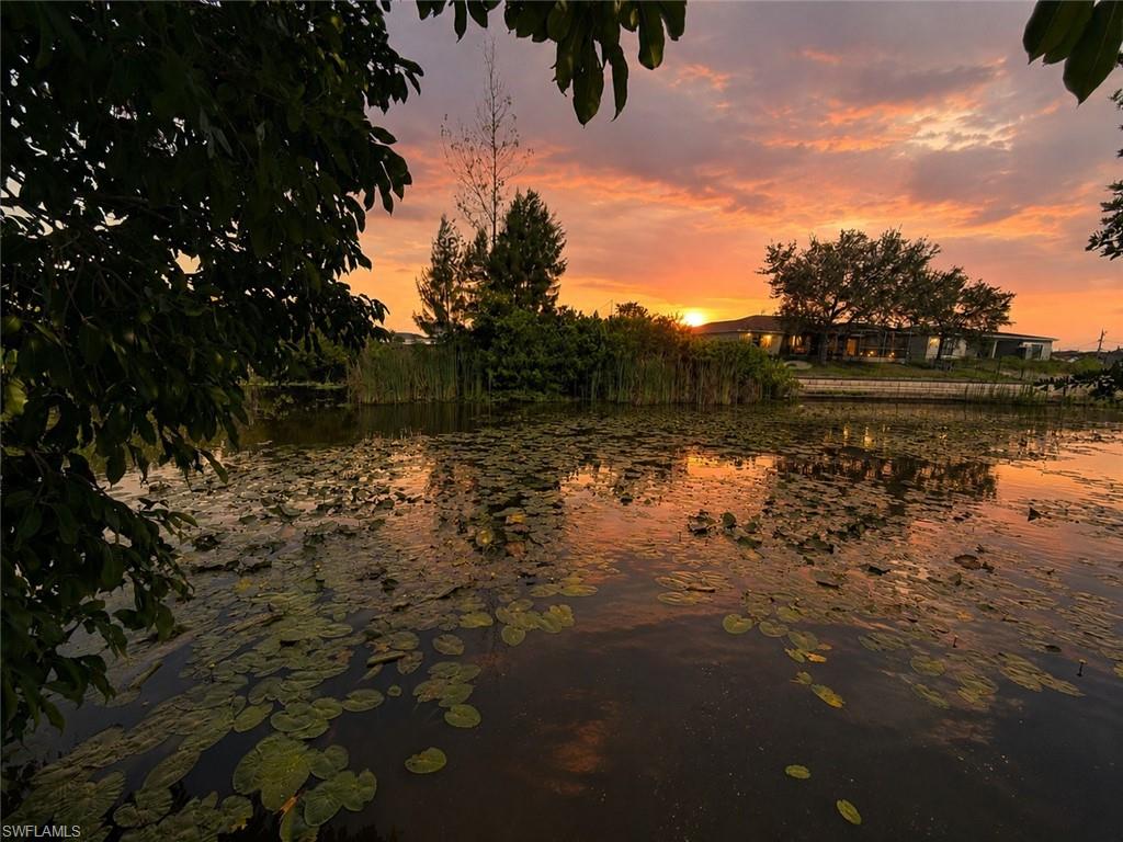 Discover the perfect place to build your dream home on this beautiful 0.24-acre WESTERN EXPOSURE waterfront lot in desirable NE Cape Coral. Gorgeous SUNSETS!  Situated on the scenic Villanova Canal, this freshwater property offers the ideal setting for kayaking, fishing, and enjoying Florida's natural beauty. Cast a line for largemouth bass and panfish, or relax while watching seasonal ducks and wading birds right from your backyard. The lot has already been improved with fill dirt, providing added value and potential savings for the future owner. Conveniently located near shopping, dining, and highly rated schools, with city water and sewer already in place, this homesite offers the perfect combination of convenience, recreation, and peaceful waterfront living.