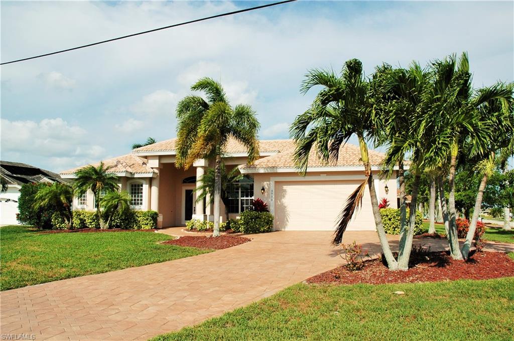 GULF ACCESS, pool home in very desirable SW Cape Coral area just off of Beach Pkwy., on an over sized corner lot.  Floor plan is very open with 90 degree corner sliders, (impact/hurricane rated), that open up to a beautiful lanai and pool. Composite wrap around dock with re-carpeted bunk boards and new nautical manila ropes at dock pilings, with a 10,000 lb. boat lift. Pool is heated and lighted and has a new pool pump. Living areas and kitchen all have views to the pool area. Master bedroom also opens to lanai and includes two walk in closets, duel bathroom sinks, jetted tub and separate shower. The #2 bedroom has its own private bathroom and the third bedroom has direct access to the third bathroom. Nice utility room with wash up sink and lots of storage. New appliances, new hot water heater, new exterior lights, new side garage door and new key entry pad. Premium sliders, (impact glass), have been rebuilt to like new condition. LED lighting throughout the home and whole house audio system w/flush ceiling speakers inside and on the lanai.  Garage is over sized. This home is MOVE-IN-READY with all the furnishings negotiable. Home has been used as a successful vacation rental.