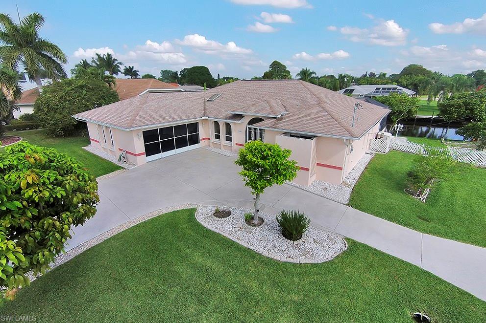 Tastefully & lovingly maintained by original owners. Sailboat gulf access canal is minutes to the river - walking distance to Rosen Park & public boat ramp. Huge dock, 7,000 lb lift & Boat Canopy. Circular drive. Productive Garden area, exotic Fruit trees like Sugar Apple, Jack Fruit & Longan (income producing!) Mangos too! Huge newly screened in pool, beautifully resurfaced 3.18.15  & a pool bath. Lanai has large shaded & unshaded areas with outdoor kitchen area & pass-thru to kitchen. High, beamed cathedral ceilings with a skylight. Bright clean & open. 100% ceramic shiny white tile. Kitchen open to all - quality Stainless Steel appliances, island with NEW Jenn Air cooktop and newer Fridge. Artistic New Backsplash. New Disposal and new Dishwasher. 100% storm protection incl. electric on lanai to seal off the outdoors; accordion & manual shutters elsewhere. Screened door on lg 2 car garage allowing the breezes to blow thru. Indoor laundry, washer & dryer incl. Huge master with sliders to pool, massive walk-in closet,garden tub,solarium. ALL THIS PLUS A 1 YEAR HOME WARRANTY for the buyer's peace of mind. This Home is a breath of FRESH AIR! Very Easy to show. Priced to Sell quickly.