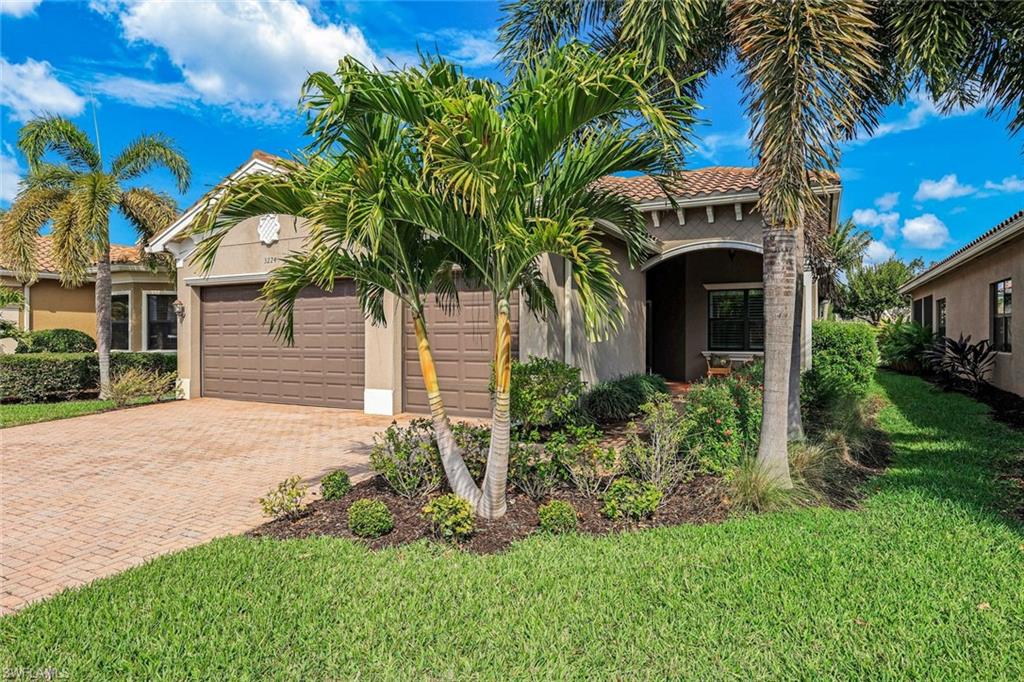 Paradise feels close at hand in this beautifully maintained Cabernet floor plan, perfectly positioned on a serene lakefront homesite in Riverstone. From the moment you step through the door, sparkling water views draw your eye beyond the main living spaces, creating a tranquil backdrop. The screened lanai becomes a natural extension of the home—ideal for morning coffee, alfresco dinners with friends, or relaxed evenings enjoying warm Gulf breezes. Designed for both entertaining and everyday ease, the open-concept layout seamlessly connects the great room, formal dining area, breakfast nook, and gourmet kitchen. The kitchen is appointed with upgraded white cabinetry, granite countertops, stainless steel appliances, reverse-osmosis water at the sink, and subtle accent lighting that adds warmth and dimension. The primary suite offers a peaceful retreat with calming lake views, dual walk-in closets (including one with custom built-in), and a spacious ensuite bath. Two additional bedrooms, three full baths, and a versatile den provide flexibility for guests, hobbies, or a dedicated home office. Thoughtful upgrades throughout include easy-care tile flooring, plantation shutters, crown molding, designer lighting and fans, a Kinetico whole-home water treatment system, decorative impact-glass front door, and a garage complete with overhead storage and utility sink. Electric hurricane screens enclose the lanai at the touch of a button, delivering protection, privacy, and peace of mind. The expansive backyard offers ample room to design your own tropical oasis with a custom pool, specifically tailored to your vision of SWFL living. Located in Riverstone, a vibrant, vacation-inspired community for all ages in North Naples, just minutes from I-75 and zoned for A-rated schools. Residents enjoy a fitness center, social hall, resort-style pool, lap pool, spa, five lighted tennis courts, outdoor basketball and pickleball, a full indoor basketball court, tot lot, children’s water play area, game room, and an activities coordinator; making it easy to meet new friends. This home offers a wonderful opportunity to embrace lakefront serenity, active living, and the very best of the Naples lifestyle.