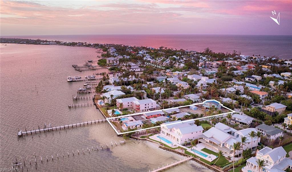LSI Companies is pleased to present an unparalleled and rarely available redevelopment opportunity in Captiva, Florida, well suited and poised for up to three private luxury estate homes or lucrative investment rentals. Located on the bay side of Captiva directly on Pine Island Sound, this 0.9± Acre property offers a recently reconstructed 1,450± Sq. Ft. shared private boat dock with slips and lifts, making it accessible directly by boat via deep water Roosevelt Channel (8–8.5' average depth) or vehicularly via Captiva Road, and offering the utmost convenience to avid mariners. It is comprised of two parcels on Captiva Island, one of the most world-renowned vacation and secondary luxury home destinations. Superb, walkable access to the sugar sand beach on the Gulf of Mexico is close by.

Located in close proximity to Sanibel, Pine Island and Fort Myers Beach. Nearby landmarks and attractions include South Seas Resort, McCarthy's Marina, Jensen's Marina & Cottages, Tween Waters Island Resort & Marina in addition to Captiva Square, Bubble Room and much more. To the North is the Rauschenberg Estate, and around the corner is Chadwick's Square, which hosts Starbucks, Sunny Island Adventures, and numerous other retail opportunities. Captiva has a rich cultural history and is home to art galleries, local festivals, and boutique restaurants offering residents and visitors an enriching experience.

HIGHLIGHTS:
• Secluded waterfront redevelopment opportunity with recently reconstructed shared dock on deepwater Roosevelt Channel
• Zoned RM-2 (Multiple-Family Districts) with future land use designation “Outlying Suburban,” allowing up to (3) dwelling units per acre
• This is the only bayside development site currently available consisting of two lots
• Unparalleled opportunity for luxury estate homes or lucrative vacation rentals
• Rentals on Captiva are generally restricted to weekly, but nightly rentals were grandfathered in on this property (may transfer to a buyer)
• Superb walkability to Gulf Beach access points and the Village