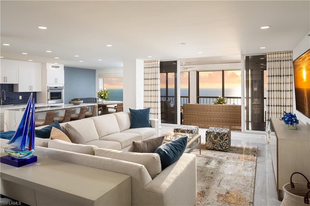 Direct Beachfront 16th Floor Luxury Condo with Breathtaking Views. This completely remodeled condo features a reimagined floor plan, opening the living room and kitchen to spectacular Gulf views. Updates include raised ceilings, redesigned bathrooms, new cabinetry, designer flooring, and more. Offering over 2,600 square feet of living space, this stunning condo feels like a single-family home, with panoramic Gulf views and refreshing trade winds from nearly every room.  Enjoy the sugar sand beach right at your doorstep and experience front-row views of majestic sunrises and sunsets from the comfort of your two screened lanais. The chef’s kitchen is equipped with top-of-the-line appliances, perfect for effortless entertaining with an open floor plan, three separate dining areas (indoors and outdoors), and a large kitchen island. Family and guests will appreciate the beautifully appointed, spacious guest bedrooms, each featuring its own en suite bath. Both rooms provide direct access to the lanai, the perfect spot to savor morning coffee while taking in stunning eastern sunrises. The Carlysle is among the most desirable buildings in Bay Colony, offering an atmosphere of timeless elegance and sophistication. From the grand lobby and front entrance to the refined elevator lobbies, meticulously designed driveway, and lush landscaping, every detail is truly remarkable. Additional highlights include two underground parking spaces. Residents of Bay Colony and Pelican Bay have access to exclusive amenities including three beachfront restaurants, three tennis centers, nearly three miles of private beach, a state-of-the-art fitness center, and scenic biking paths. Plus, enjoy access to the Artis Center for the Performing Arts, Mercato, and Waterside Shops, just steps away.