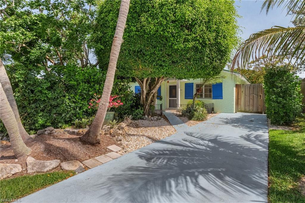 Exactly ONE mile to Vanderbilt Beach and SEVEN TENTHS of a mile to the Mercato - that's less than a 4 minute bike ride before you're dipping your toes in the Gulf of Mexico, shopping at Whole Foods, taking in a movie or enjoying some of Naples top restaurants! Sun, sand, restaurants, shopping and entertainment at your fingertips! This adorable turnkey bungalow is ready for use as a year-round residence, beach vacation retreat or as a rental with tremendous income potential. Naples Park has no restrictions on rentals or pets! The peaceful, manicured, fenced yard with Zen-like quality and gorgeous, shaded front courtyard give you plenty of space to soak up the sunshine, enjoy quiet moments, and entertain. Welcome home to Naples Park! (Metal roof added in 2016)