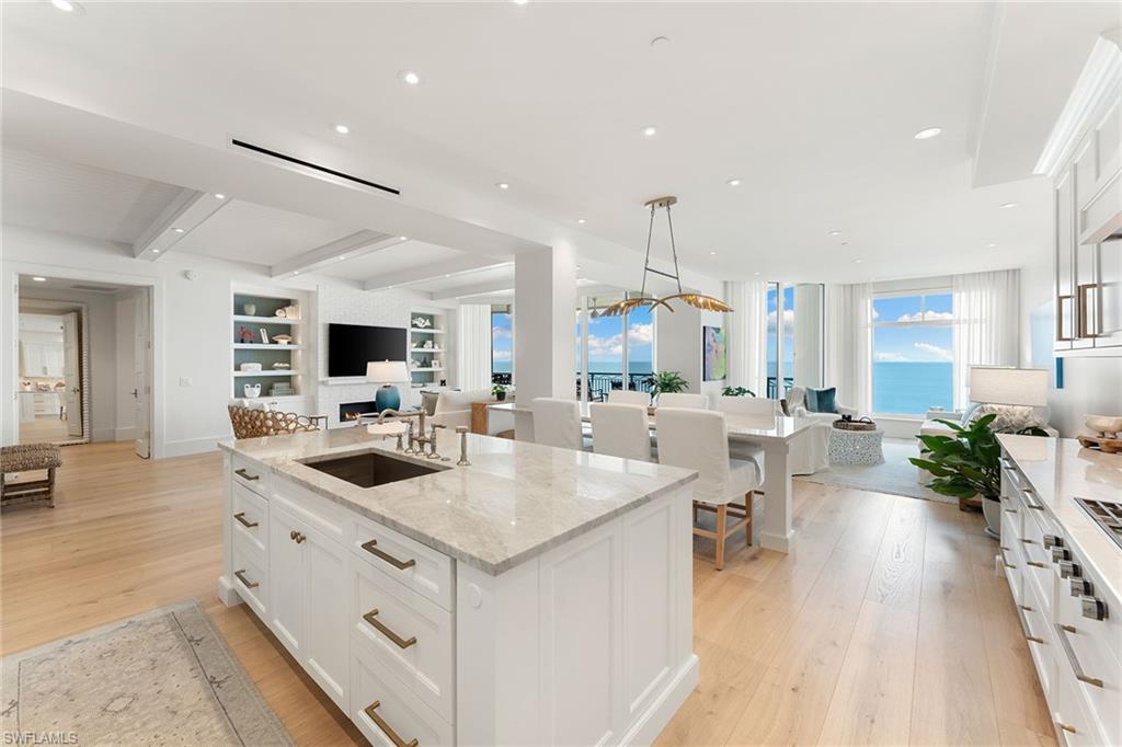 Completely renovated over the last two years, the level of finishes chosen is typically only found in the most sophisticated homes. This beachfront home in the premier location of Marco Island provides unobstructed views of the Gulf of Mexico mere steps away from the pristine white sand. The adventure starts at the exit from the elevator to the private foyer, which is graced with designer wallpaper, 10-inch white oak flooring and a 5-foot wide sculptural chandelier. Enter through the double front doors and the million-dollar views begin, inside and out. The living room boasts a brick fireplace, flanked by expansive lighted bookshelves and cabinets, and exposed ceiling beams. The cook’s kitchen flows seamlessly between the living room and the comfortable family room, with easy access to the large deck where al fresco dining, dolphin sightings and sunset gatherings are daily gifts. The gourmet kitchen includes quartzite countertops and backsplash, paneled Sub-Zero appliances, Wolf stove and ovens, and double refrigerator beverage drawers. A working island and an eating island complete the entertainer’s dream kitchen. The owner’s suite provides privacy, show-stopping beach views, and entrance to the West-facing deck. In the primary bath, enjoy double vanities with an abundance of storage, a spacious walk-in shower, and hardwired towel warmer. All closets have been reimagined by California Closets. A bonus walk-in closet adds additional unexpected storage. Two secondary en-suite bedrooms are served by fully renovated bathrooms and have access to the separate sunrise deck with views of the 10,000 Islands. Veracruz, within the Cape Marco community, has gated and manned 24-hour security with on-site management and front desk concierge. Amenities include a stunning infinity edge pool overlooking the beach with a second shaded grotto pool below, tennis courts, fitness center, theater room and social room. Three guest suites allow for friends and family gatherings throughout the year.