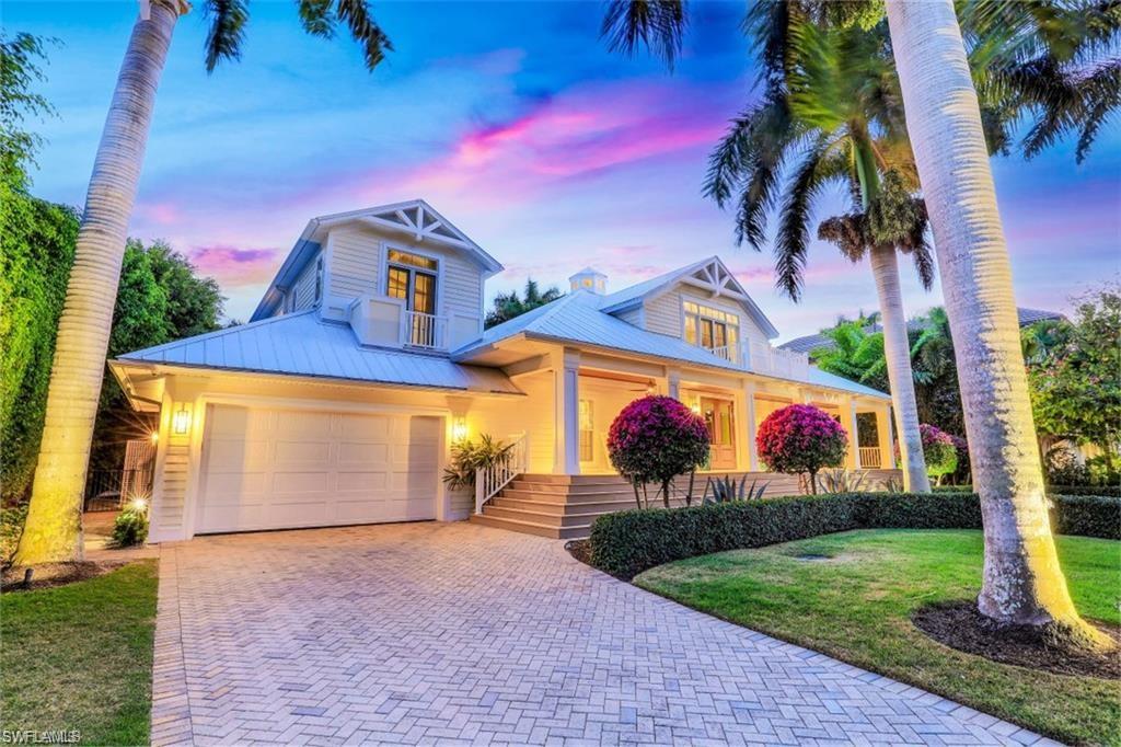 Award Winning Olde Naples Home – only three homes away from the beach! Over 5,000+sf, Turnkey Immaculate 5 bedroom 5-1/2 bath,
including two master suites with bonus loft, formal office study, and unmatched outdoor spaces sitting on .34 southern exposure lot, and a
short stroll to 5th Ave downtown. New pool and spa in 2018. Renovation of the year managed by Ficarra Design with Traditional Coastal
appointments and decor. Palatial interior, bright and airy vaulted ceilings, all custom carpentry, inlaid ceilings with beams, shiplap, clean lines to
achieve a sophisticated coastal casual Olde Florida charm. White washed wood oak floors, soft tones with warm natural wood furniture and
décor. Gourmet kitchen, shaker stylings, Bosch appliances, pantry, ample custom storage. Six sets of French doors line the pool and spa,
outdoor kitchen and bar, Lynx, ice fridge, and more, serves seating area under beautifully appointed covered lanai with roll down
screens/shutters. Landscape lighting, shuffleboard court and rare alley access. High impact glass throughout, Smart Lutron lighting, long front
porch and balconies overlook lined queen palms and manicured estate lot. See 3D Tour