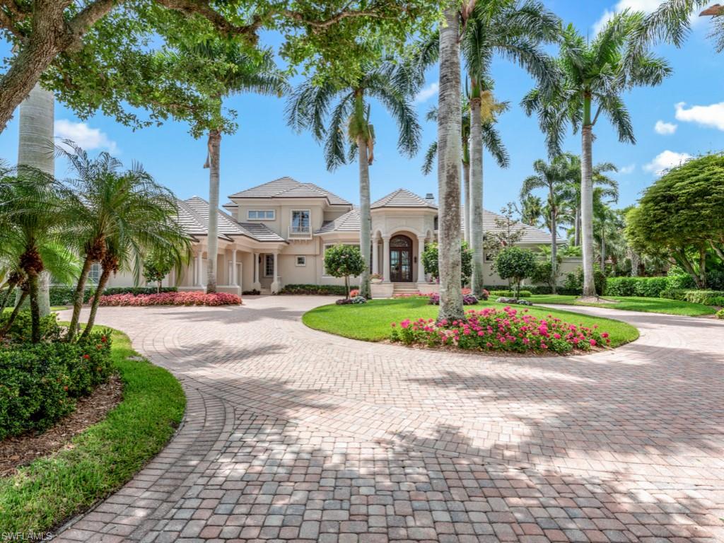 Welcome to Resort Style Living in this gorgeous custom London Bay built home! The curb appeal, with its stately elegance and beautifully landscaped long circular driveway, welcomes you into this classic, spacious home with the “WOW” factor of the view and pool/spa/outdoor living areas.  The property is very bright with large windows and recessed sliding doors, and very neutral décor. Impeccably maintained home with a newer roof, all appliances, pool equipment, lanai with picture window screens, AC’s, hot water heaters and so much more.  The open gourmet kitchen offers a Wolf gas range, Sub-Zero refrigerator and freezer, abundant beautiful cabinetry, and open family room which create a perfect blend of indoor-outdoor living.  Panoramic South views of lake and golf and manicured large backyard and landscaping. The oversized lanai with its built-in kitchen, dining areas, various sitting and lounging areas, bright blue newly redone pool, spa, and water feature are so inviting, one cannot resist.  The inviting primary suite has built in closets, dual bath areas and is located near the very handsome den/office.  All the guest rooms are all ensuite, and one is a private cabana opening to the lanai. The other 2 plus a playroom, are on the second floor.  This home offers an oversized garage with 3 bays plus added space.  Large laundry room and storage areas.  You will not find another home with this level of quality, beauty, attention to detail and comfort for you and your guests.  See additional Feature sheet.