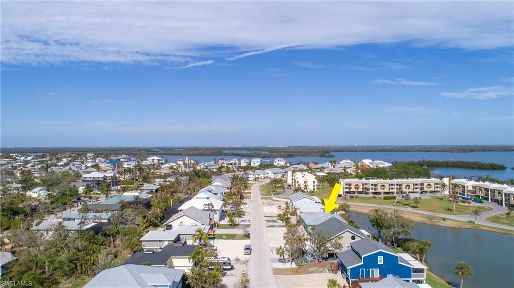 Fort Myers beach Duplex, Live on one side and rent the other side, beautiful Lake view, with private balconies on each side. A 3 minuet walk to the Sugar sand Beach that includes fishing and Dolphins hunting the shoreline. This Home with rental availability has nothing but upside, the sky is the limit. Both units have been recently updated with oversized tile throughout, with new modern bathrooms to die for. Remodeled Kitchens with all the modern touches. Both units have their own private laundry rooms each side. Right side has electric at the carport to charge your Tesla. The Left side has a gigantic storage room that can be used to your imagination, a studio, a craft room, etc..... Enjoy a bike ride to Time square to all the restaurants and Music. Or stay closer to Junkanoo at the back Bay for great food and Entertainment.