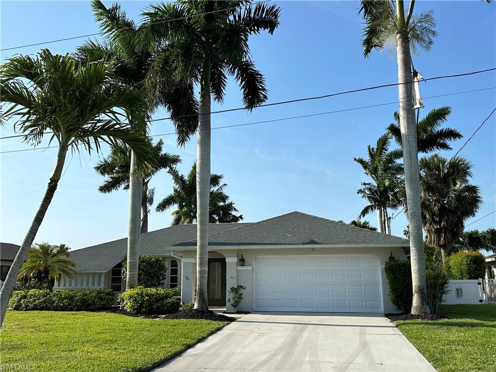 Honey, Stop the Car!! Direct Access with No Bridges ~ 3 Bedrooms ~ 2 Full Bathrooms ~ 2 Car Garage ~ Pool Home w/ New Screen Enclosure and Pavers ~ EXTREMELY WIDE & DEEP CANAL ~ Concrete Dock w/ Water & Electric ~ Only a couple Minutes to Caloosahatchee River & Gulf Of Mexico ~ 1510 Sq. ft Of Living Area ~ Front Entry ~ Kitchen Features Granite Counter Tops & Backsplash ~ Stainless Steel Appliances ~ Kitchen Cabinets have Soft close Drawers/Cabinets & a Lazy Susan ~ Kitchen overlooks the Pool Area & Water View ~ Separate Dining Area ~ Tile Flooring throughout Except Guest Bedrooms ~ High-End Berber Carpet ~ Bathrooms Updated Including Granite Counter tops ~ Newer Roof, End of 2021 ~ Brand New Pool Cage ~ All Duct Work Replaced 2013 ~ Freshly Painted Inside & Outside ~ Outdoor Fire Pit ~ 6" Baseboards ~ Crown Molding ~ 2 Separate Additional Patio Lanai Area's ~ Trane AC ~ Recessed Lighting ~ Central Water & Sewer, Irrigation w/ No Assessments ~ Do NOT hesitate, it may be to late ~ So, Honey, Stop the Car, We found Our Dream Home !!