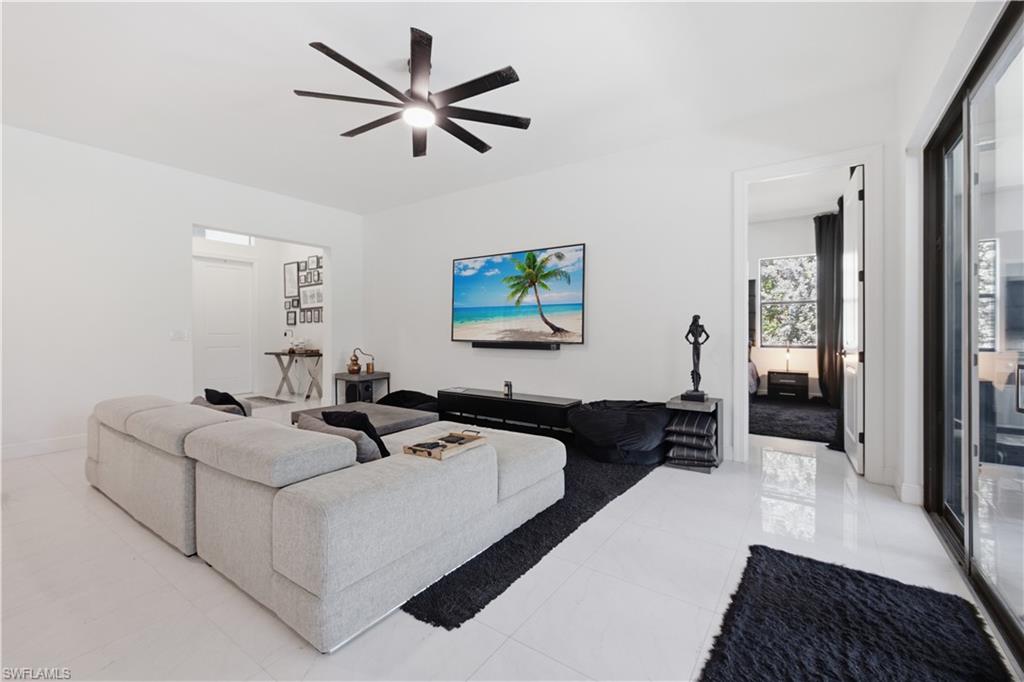 Welcome to this beautifully maintained newer-built (2022) home offering the perfect blend of modern design, privacy, and the Southwest Florida lifestyle. Situated on 1.14 acres, this spacious 4-bedroom plus den, 2-bath residence features an open-concept layout with tile flooring throughout, quartz countertops, black matte fixtures, IMPACT windows and doors, and a well-appointed kitchen with Samsung stainless steel appliances. Step outside to your own private retreat featuring a HEATED SCREENED IN POOL, CUSTOM OUTDOOR KITCHEN, and a fully FENCED YARD with plenty of room to relax or entertain. An EXTENDED 2 CAR GARAGE to fit any large vehicle and  an OVERSIZED SHED for extra storage. 
With no HOA and ample space for your boat, RV, or other toys, you'll enjoy the peace of country living while remaining just a short drive from shopping, dining, and everything Naples has to offer.