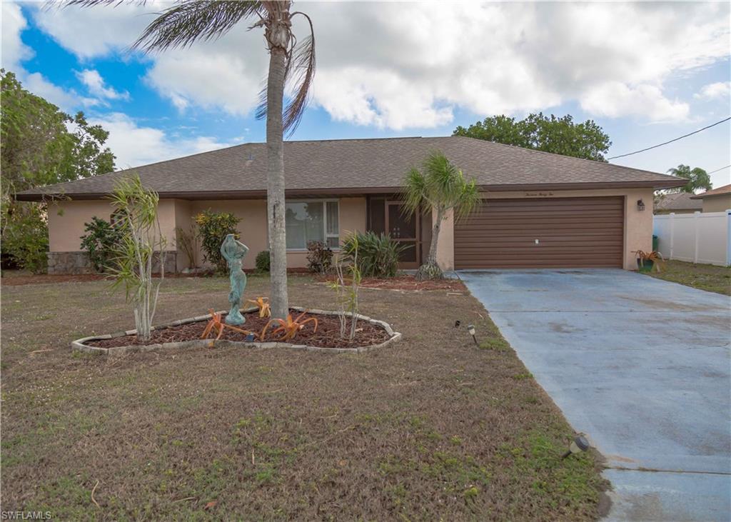 Completely fenced, updated master bath, new air conditioner, stainless steel appliances, tile throughout, and freshly painted- are just some of the perks when owning this roomy 2 bed- 2 bath Florida ranch style home. Located in the most sought after SE section in Cape Coral -be within just a short distance to stunning parks, extravagant shopping malls, delightful coffee shops, delicious restaurant hot spots, Cape Coral's public beach, highly rated Charter schools, and one of the best hospital systems in the United States- Lee Memorial Health systems. SWFL International Airport and the City of Fort Myers are just right over bridge.  This home is truly in the center of it all. Well maintained with tons of care and lots of love - this home will surely be a place you can be happy and proud to call home. (City water and sewer in and paid)