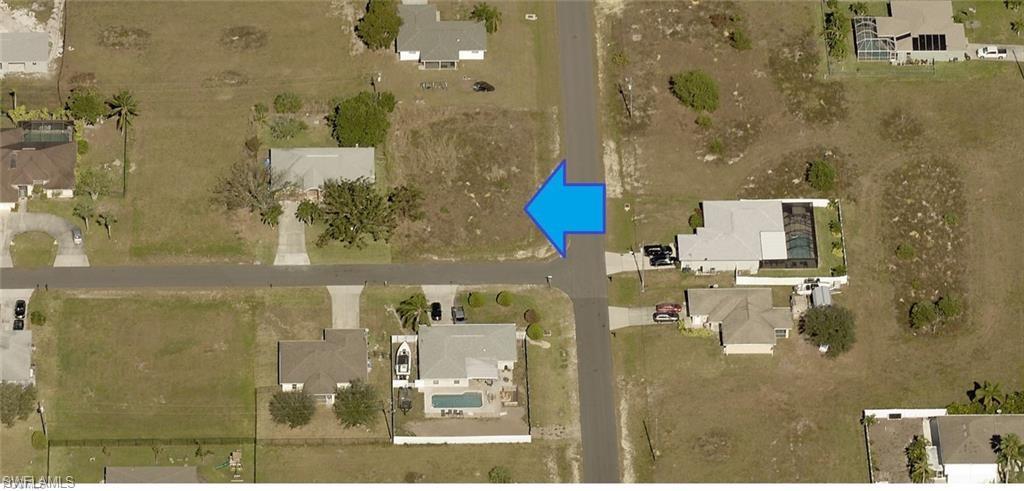 Corner lot priced to sell! This desirable residential lot features city water and sewer and is located outside of a flood zone, offering peace of mind and lower insurance costs. Surrounded by newer homes in a rapidly growing area, this property is the perfect opportunity to build your dream home or invest for the future. Conveniently located near shopping, dining, schools, and all that Cape Coral has to offer