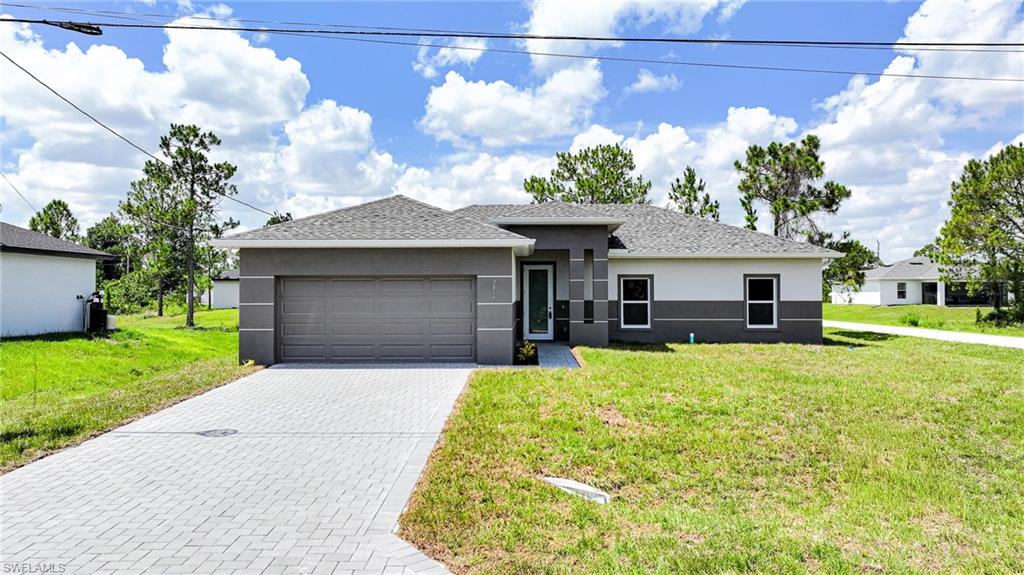OVERSIZED CORNER LOT! You Will Be Amazed By The Quality Of This Brand New Construction 3 Bedroom (Plus Private Home Office/Den/Or 4th Bedroom With Solid Wood French Doors) 2 Bathroom/2 Car Garage Corner Lot Home With Southern Exposure For Those Stunning Florida Painted Sunsets, All On An Oversized .28 Acre Corner Lot In Lehigh Acres, FL. This Spacious Home Comes With 1682 SF Under Air And Is COMPLETELY Finished With A Certificate Of Occupancy (CO)! You Can Move Into This Home Today Or Use It As A Cash Flowing Rental Unit (Very High Demand). The Gourmet Island Kitchen Comes With Quartz Countertops, STAINLESS STEEL APPLIANCES, Real White Wood Shaker SOFT TOUCH Cabinet Doors & Drawers, Tile Backsplash, Floor To Ceiling Pantry, Stainless Steel Tub Sink, Modern Lighting, And A Large Breakfast Bar. Other Upgrades Include; FREE BRAND NEW WASHER AND DRYER WITH PURCHASE OF THIS PROPERTY, HURRICANE IMPACT GLASS WINDOWS AND DOORS, Large Designer High Gloss Porcelain Tile Flooring Throughout Entire Home, PAVER DRIVEWAY, High Ceilings, Large Living Room, Upgraded Baseboards, Large Dining Area, Custom Interior/Exterior Two-Tone Paint, Custom Ceiling Fans, Modern Lighting, Large Walk-In Closets, Quartz Countertops In The Bathrooms, Huge Back Yard, New Landscaping Package, Epoxy Coating In The Garage And On The Open Covered Lania, And A Laundry Area Including A New Washer & Dryer Inside Of The Home. This Home Is Very Close To Regional Shopping Malls, SR 82 And Fort Myers, Golf Courses, Interstate I-75, Regional Airport, FGCU, Restaurants, Schools, Golf Courses, MLB Spring Training Baseball, Outdoor Parks, Boat Ramps, Amazing Fishing, And Those White Sand Beaches Of The Gulf Of America! Pools & Fences Can Be Added! DOWN PAYMENT ASSISTANCE IS AVAILABLE!