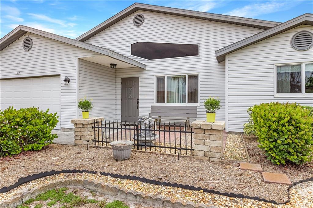 ASSESSMENTS PAID for this 3 bedroom, 2 bathroom home is on a 3 LOT SITE and FENCED with SOUTHERN exposure in the PELICAN area.  As you walk into the home, you have nice high 12 ft ceilings with plenty of light from windows and NO carpet in the entire home.  You have a nice large great room that overlooks your kitchen that features SOLID WOOD CABINETS with PULLOUT DRAWERS, STAINLESS STEEL appliances, CAMBRIA Counter tops, tall pantry with pullout drawers, and SKYLIGHT in kitchen to give you extra lighting.  Your master bedroom is located on the opposite side of your guest bedrooms with a nice large walk in closet.  On the other side of the home, your guest bedrooms are good size with a bathroom to share with your guests.  Your laundry room has a sink, front load washer & dryer with pedestals.  You also have a SUN TUBE light in the laundry room.  As you go out to the screened lanai, that overlooks the large oversized lot and an EXTRA LARGE SHED 10 x 16 which you could make it a She shed or He shed.  AC is a 19 Seer - Water heater 2018 - Impact windows throughout but kitchen window & sliding doors.  You are near the library, dining, shopping, Pelican Elementary & much more.