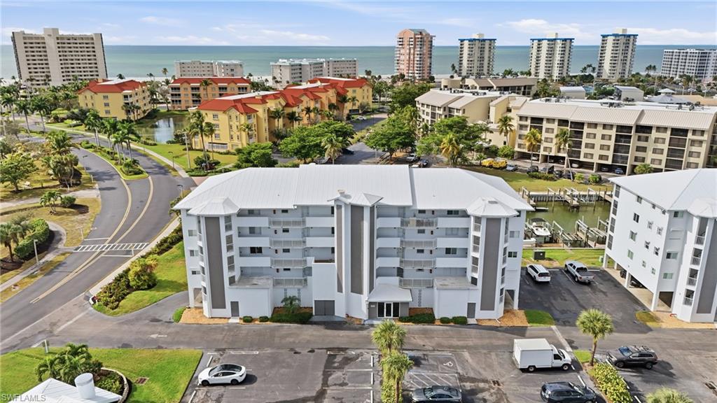HUGE PRICE REDUCTION!  MAKE IT YOURS!  Attention boaters!  Do you want a 2 bed / 2 bath corner-unit condo located on the highly desirable south end of Fort Myers Beach? This well-maintained second-floor residence features a convenient one-level split floorplan, offering excellent privacy for owners and guests. As a corner unit, it enjoys abundant natural light throughout and a spacious feel. The screened balcony overlooks the end of the canal, providing peaceful water views and stunning sunsets right from home.

Located in a true boating community with direct Gulf of America access, this property is perfect for water enthusiasts. The community is not age-restricted and has been completely rebuilt since Hurricane Ian, offering fresh updates, modernized features, and a renewed coastal atmosphere.

Residents can also join the excitement of the Fort Myers Beach rebuild, with brand-new dining, entertainment, and retail options now open at nearby Santini Plaza.

The community offers an outstanding lineup of amenities including:
• Two heated pools
• Pickleball and tennis courts
• Fishing pier
• Shuffleboard
• Winding walking trails
• Clubhouse with social spaces
• Deeded beach access just across the street

A vibrant activity schedule includes card and game nights, pancake breakfasts, holiday parties, and more—something for everyone to enjoy.

This condo is being sold fully furnished and is move-in ready as a full-time residence, seasonal home, or investment property. With an unbeatable combination of location, lifestyle amenities, boating access, and updated community infrastructure, this property is priced right and ready for its next owner.  Seller is motivated!