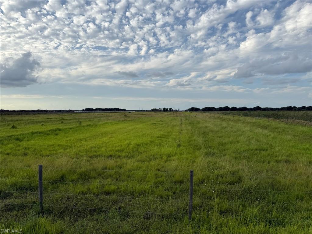 Unique 130  +/- acre farm, located in a thriving agricultural area just south of LaBelle. Cleared, fenced/cross fenced, with single wide trailer, shade house, and more! This property is zoned Ag-2, which allows agricultural or residential use, and is ideal for anyone looking to start a farm, ranch, or country homestead. The canal at the north end of the property is available for irrigation and serves as a natural border to the property. Farms in the area grow row crops, sugar cane, and tropical fruit (lychee, mango, dragon fruit, passion fruit, etc.) in addition to citrus. Approximately 1 hour from RSW, and 45 minutes from I-75  via SR 29 in Immokalee or SR 80 in Fort Myers. Property is in the Gerber Water District and subject to the Water District tax which is collected by the Hendry County Tax Collector and is used to maintain the roads, canals, and employ security. The roads are private and monitored by a security guard to prevent trespassing.