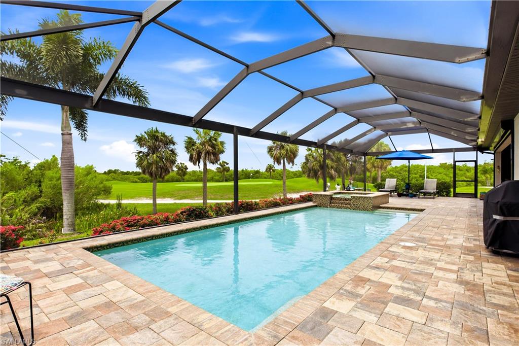 Welcome to Sunset Views, Luxury & Golf Course Living! Situated on one of Cape Royal's premier homesites, this stunning custom residence offers sweeping golf course & preserve views & true resort-style living! Arrive to paved driveway, lush tropical landscaping, elegant architecture & impressive designer double glass entry create an unforgettable first impression! Inside, soaring volume ceilings, tile flooring throughout, impact windows & doors, designer lighting & an open-concept floor plan showcase quality craftsmanship & timeless elegance! Gourmet kitchen is designed for both entertaining & everyday living, featuring rich custom cabinetry, granite countertops, oversized island w/ seating, stainless steel appliances, wall oven, built-in microwave, wine bar w/ wine cooler, spice rack cabinet, baking sheet cabinet, lazy Susan corner storage, three additional custom cabinets & two built-in charging stations. Spacious great room w/ cornerless pocketing sliding glass doors fully retract, opening the great room to an incredible screened lanai where indoor & outdoor living become one. The luxurious owner's suite offers private lanai access, two oversized walk-in closets & spa-inspired bath w/ dual vanities, freestanding soaking tub & expansive walk-in shower w/ rainfall & dual shower heads. Guest suites are generously sized, offering walk-in closets & beautifully appointed pool bathroom. Split floor plan provides privacy for family & guests. Screened lanai is an entertainer's dream featuring spectacular heated oversize pool (13' x 39') w/ 3-5.5 ft depth range, LED color-changing lighting & smartphone-controlled pool & spa automation. Oversized 6' x 6' spa, outdoor hot & cold shower, expansive covered seating areas, outdoor wet bar w/ refrigerator & ice maker & panoramic golf course views! Additional upgrades include Ring security system, QuickSet digital locks, Wi-Fi enabled garage doors with MyQ technology, battery backup garage door openers, 4' x 8' overhead garage storage rack, spacious laundry room w/ utility sink & epoxy garage floor. Cape Royal offers one of SWFL's finest lifestyles w/ a recently renovated 27-hole championship public golf course, clubhouse w/ restaurant & bar, tennis, pickleball, bocce, walking paths & optional golf membership. Residents enjoy equity ownership in the golf course, low HOA fees & the convenience of being located in unincorporated Lee County with NO Cape Coral city taxes. Additional buyer benefits include transferable flood insurance ($1,873/year), homeowner's insurance ($3,100/year), available survey, elevation certificate & building plans. The golf cart, lanai furniture & interior furnishings are negotiable, making this an exceptional opportunity for a move-in-ready Florida retreat! Located just min from Burnt Store Marina, Matlacha, Pine Island, waterfront dining, world-class fishing, boating, shopping & Gulf beaches, this extraordinary property delivers luxury, convenience & the ultimate golf course lifestyle!