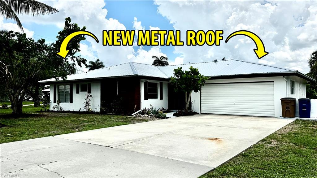 Attention kayakers, fishers, and lovers of all things Florida: here is your home! Direct gulf access, just 2 minutes from the open expanse of the Caloosahatchee River, this property creates the lifestyle you've been looking for! Owner has just put $30K into home upgrades including a NEW METAL ROOF, fresh exterior paint, new exterior light, new flooring in the lanai, new landscaping, and various repairs on the interior.  There is a double-sided wooden dock on either side of your private boat ramp, freshly stained, one side large enough for a sitting area or dining area (wooden dock was built over the existing concrete dock). There is a 10,000 lb boat lift, which accommodates a pontoon OR a v-bottom boat. You can even catch blue crab right from the dock. Inside the home is completely tiled, granite countertops, and stainless steel appliances. The property has some beautiful mature landscaping, including coconut, banana and mulberry trees, muscadine grape vines and gorgeous Bottle Brush Trees. Enjoy evening sunsets from your backyard, fish from the dock, and store your boat without having to pay any marina or storage fees. Ideal for your primary residence, your winter home, OR a seasonal rental. If you are looking to buy nearby homes with friends and family, the owner is also selling the home next door at 147 Coral Drive. Or, buy one to live and one to rent. Both homes would also make great AirBNB's - no community restrictions!
