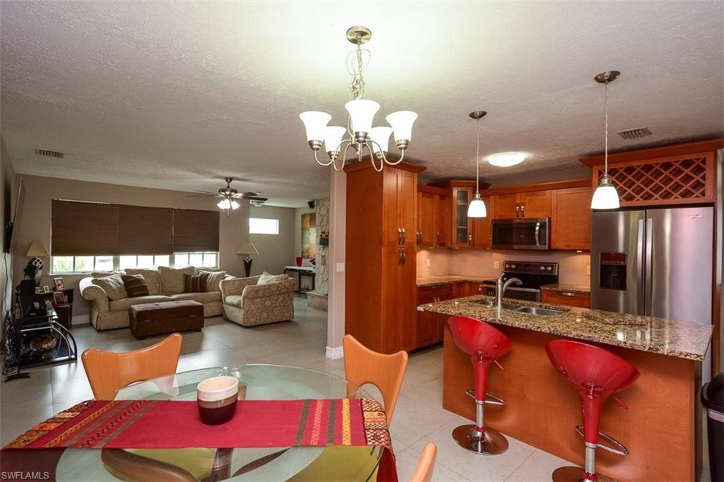 Looking for an affordable home in Golden Gate City that's move in ready?  Well HERE IT IS!!! Home features 3 bedrooms and a den, 2 bathrooms, 1 car garage.  Home was updated with beautiful custom wood kitchen and granite counter-top, fresh paint, all bathroom new with granite counter-tops. Home is completely tiled with 24x24 tile, huge backyard with an above ground pool to enjoy the summer and a shed that will remain with the sell.  Don't miss this opportunity to get a great home at an incredible deal!  Call me for your private showing today before this beauty is gone!!