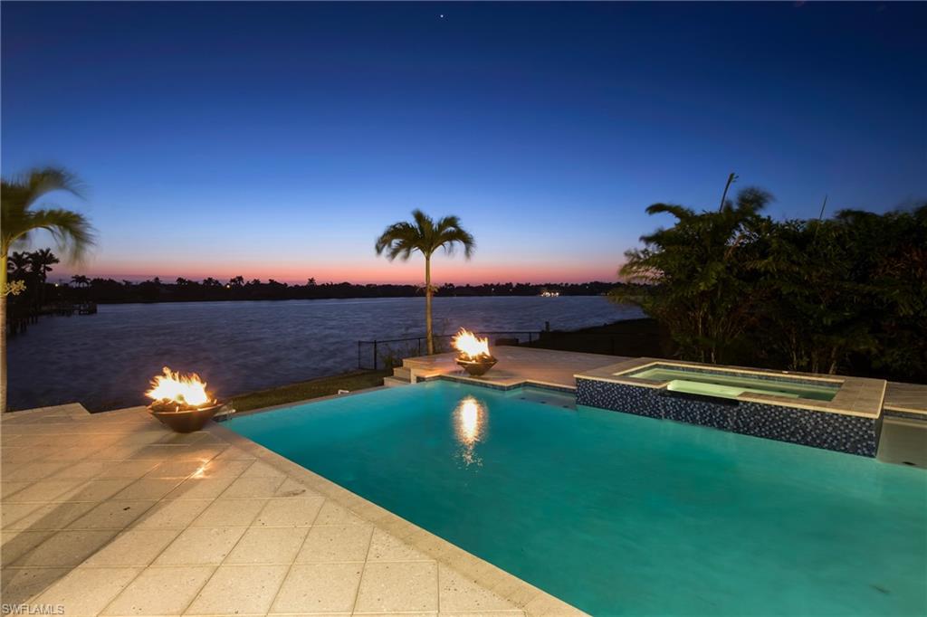 Now Complete! Great Robert's Bay mansion built by Divco to exacting standards and high end details through out. Magnificent views of the bay. great central location close to everything. The 2 story living room is dramatic with great ceiling treatment. Elevator will reach from garage to first floor and second floor. Summer kitchen and bar, vanishing edge pool, large open lanai overlooking Robert's Bay. Adjoining lot available