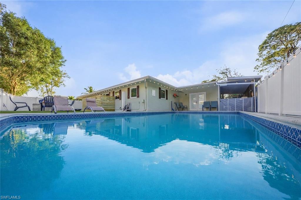Experience the ultimate Naples lifestyle in this beautifully furnished and spacious 3-bedroom, 2-bathroom residence, perfectly situated in the desirable Poinciana area. Designed for both relaxation and entertainment, this exceptional home offers an impressive array of amenities, including a private heated pool, home theater, mini golf area, game room with pool table and poker table, and a cozy wood-burning fire pit.

Step inside to discover a bright, open-concept floor plan enhanced by tasteful furnishings, abundant natural light, and modern finishes throughout. The fully equipped kitchen features contemporary appliances, ample cabinetry, and everything needed for effortless daily living or entertaining guests. The spacious primary suite provides a private retreat, while the additional bedrooms offer comfort and flexibility for family and visitors alike.

The outdoor living space is truly a highlight, featuring a screened private heated pool and beautifully designed areas perfect for enjoying Southwest Florida’s year-round sunshine. Whether you’re hosting gatherings, spending time with family, or simply unwinding after a day at the beach, this home delivers the perfect balance of luxury and comfort.

Ideally located just minutes from Naples’ world-renowned white-sand beaches, Mercato’s premier shopping, dining, and nightlife, and the upscale Waterside Shops, this property offers unmatched convenience to the area’s top attractions.

Available for long-term rental and move-in ready, this exceptional residence provides a rare opportunity to enjoy resort-style living in one of Naples’ most desirable locations.
