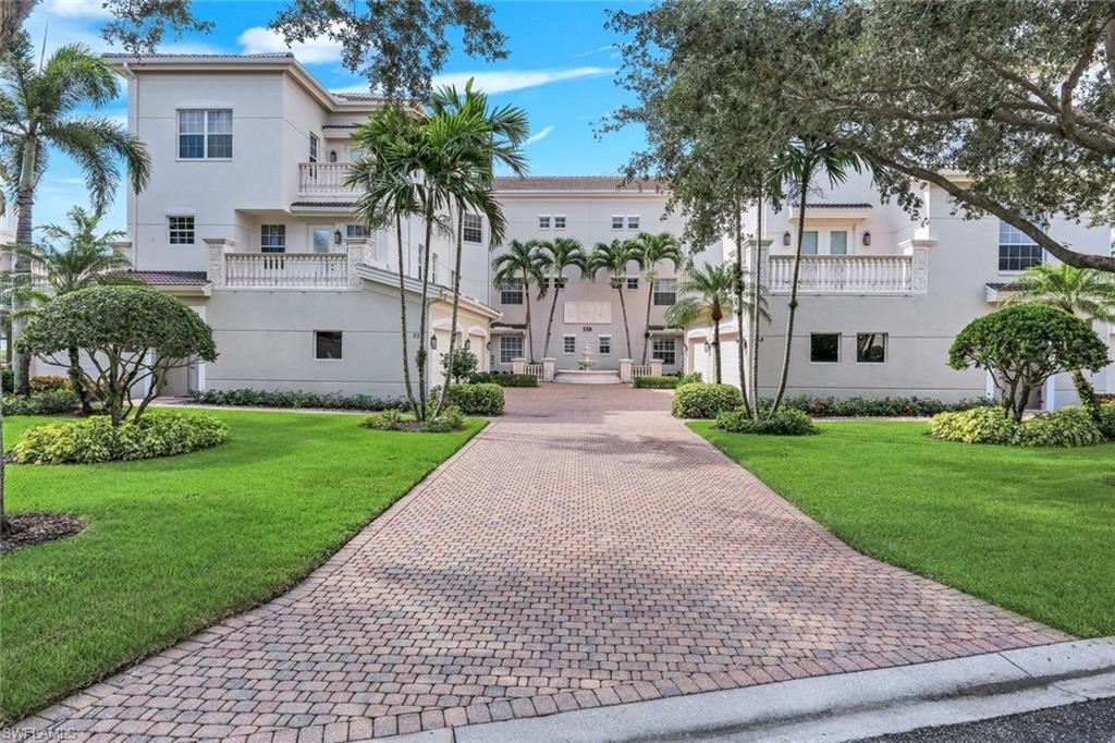 Experience effortless luxury in this beautifully appointed home located in the prestigious, double-gated community of Avellino Isles at The Vineyards, one of North Naples' most sought-after luxury neighborhoods. Perfectly positioned with long lake and golf course views, this spacious residence blends elegant finishes, an open-concept design, and the convenience of single-level living. Designed for today's lifestyle, the desirable spacious floor plan offers exceptional privacy, generous living spaces, and seamless indoor-outdoor living. The expansive screened lanai creates the perfect setting for morning coffee, evening sunsets, or entertaining. The gourmet kitchen with rich wood cabinetry and quart countertops opens effortlessly to the main living and dining areas, creating an ideal space for hosting family and friends. Bonus room can be a perfect yoga room or paint studio, or use as a walk-in pantry or storage room. Thoughtful upgrades throughout the home provide both comfort and peace of mind, while abundant natural light enhances the home's bright, welcoming atmosphere. Plantation shutters throughout. Buyers searching for luxury coach homes in Naples, first-floor condos with attached garage, maintenance-free living, golf course communities, lake view properties, resort-style amenities, and move-in-ready homes in North Naples will immediately recognize the exceptional value this residence offers. Residents of Avellino Isles enjoy miles of walking paths, a private clubhouse with a resort-style pool and spa, fitness center, library, social gathering spaces, and beautifully landscaped grounds. Located within The Vineyards, optional memberships provide access to championship golf, tennis, pickleball, wellness facilities, fine dining, and an active social calendar, while allowing owners the flexibility to choose the lifestyle that best fits their needs. Membership is optional, not mandatory. Ideally situated just minutes from Naples Artis, Mercato, Waterside Shops, Fifth Avenue South, Seed to Table, world-class dining, upscale shopping, medical facilities, I-75, and the sugar-sand beaches of the Gulf of America, this location places everything Naples is famous for within easy reach. Whether you're searching for a primary residence, seasonal retreat, snowbird getaway, or luxury Florida investment property, this exceptional home offers the perfect combination of location, lifestyle, security, and timeless elegance in one of Naples' premier gated communities. Noteworthy additions,: three motorized rolldown hurricane protection screens installed on lanai 2019. Mini-split AC installed in the bonus/flex room 2020. AC installed in 2019. Interior freshly painted 2026. Avellino recently installed new roofs and gutters, new neutral exterior paint and exterior carriage lights. A short walk to the Avellino Olympic-sized pool/spa, fitness center, BBQ grills, and more! Clean and move-in ready! Staged furnishings available for sale outside of contract.
