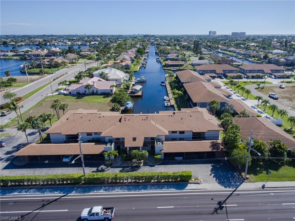 BEAUTIFUL WATER FRONT CONDO  This 2 bedroom, 2 bath condominium is over 1,000 square feet of open living space. This Southern exposure, 2nd floor unit enjoys an amazing view over the pool and down the canal. No Bridges to the Gulf of Mexico! so bring your boat and enjoy access to a beautiful boat slip with captain's walk on a first come, first served basis! Convenient to Cape Coral Parkway, shopping, dining, and entertainment.  This unit is currently occupied by a long term tenant on a month to month lease, who would like to stay. The unit was completely replumbed in 2015 ($3,000) Great  primary residence or an income producer,