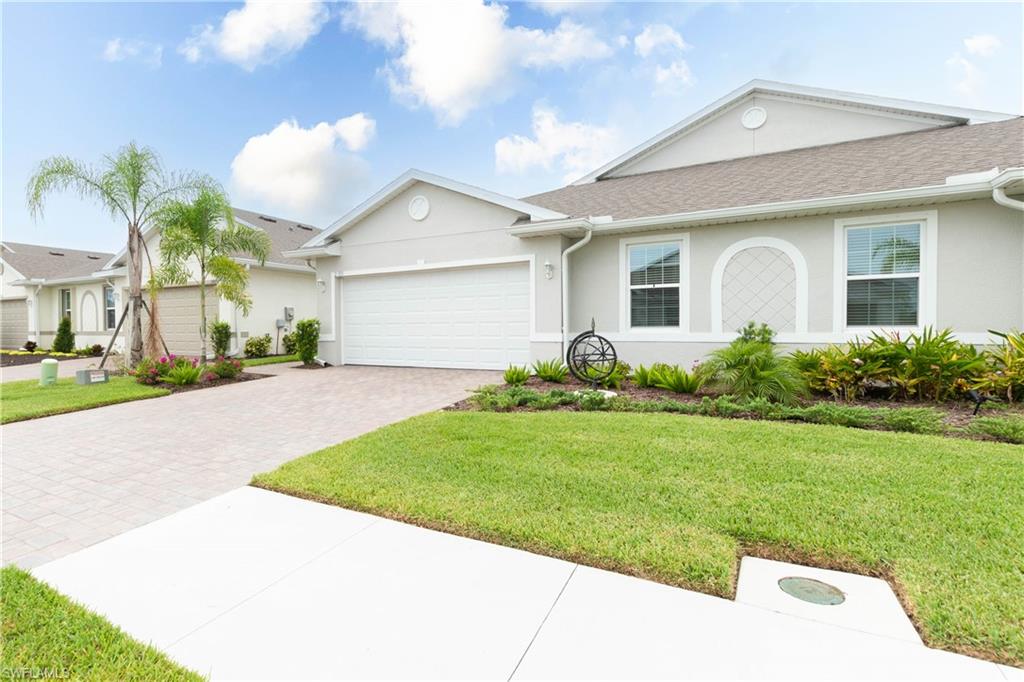Welcome to this beautifully maintained, hardly lived-in villa located in the highly sought-after gated community of Magnolia Landing! Offering 2 bedrooms, a versatile den, 2 bathrooms, and a spacious 2-car garage, this home combines low-maintenance living with thoughtful upgrades and modern finishes.

The open-concept floor plan features a bright and inviting kitchen with quartz countertops, 36-inch cabinetry, stainless steel appliances, and tile flooring throughout the main living areas. Natural light fills the spacious living and dining areas, creating the perfect space for both everyday living and entertaining. The washer and dryer are included, making this home truly move-in ready.

Step outside to your private screened lanai, where you can relax and enjoy Southwest Florida's beautiful weather year-round. The fully fenced backyard offers the perfect space for pets, gardening, or simply unwinding in your own private outdoor retreat. Additional owner upgrades include gutters, a custom shade on the sliding glass door, elegant drapes, and professionally concealed in-wall wiring for all TV mounts, creating a clean, modern look throughout the home.

The private owner's suite overlooks the backyard and features a spacious walk-in closet and an ensuite bath. The versatile den provides the flexibility to serve as a home office, hobby room, or guest space.

As an added bonus, two mounted TVs convey with the home—one located in the garage and the other in the guest bedroom—providing extra value and convenience for the new owner.

Magnolia Landing offers resort-style amenities including a championship golf course with optional membership, two community pools, a fitness center, clubhouse, on-site dining, pickleball and tennis courts, and scenic walking paths. Lawn care and exterior maintenance are included, allowing you to enjoy a truly carefree Florida lifestyle.

Whether you're searching for a full-time residence, seasonal getaway, or investment opportunity, this move-in-ready home is the perfect place to start enjoying everything Southwest Florida has to offer.