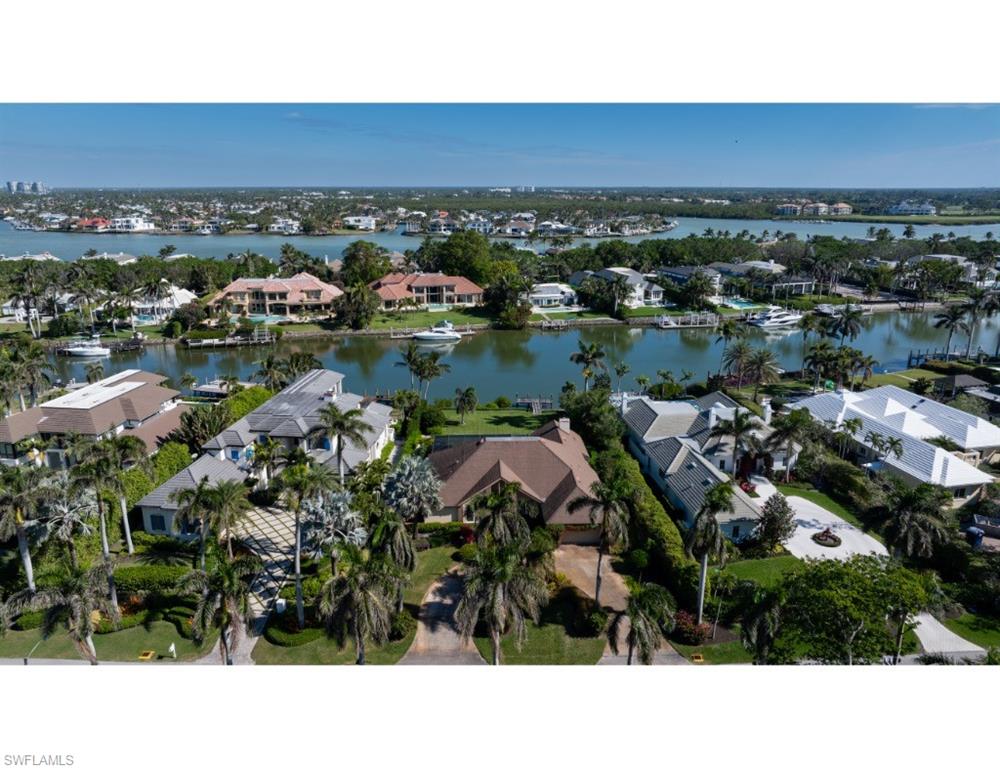 Nestled along Spyglass Lane in the prestigious Port Royal community, this remarkable property presents a rare opportunity to design and build a custom estate that takes full advantage of its tranquil surroundings. With impressive depth and a generous building envelope, the lot invites endless possibilities. Enjoy beautiful color-filled sunrises from this serene setting overlooking Runaway Bay. Boating enthusiasts will enjoy direct, no-bridge, access to Gordon Pass and the Gulf of Mexico, along with convenient routes to the inland waterways leading to the pristine estuaries of the Ten Thousand Islands. The property is being offered in “As-Is” condition. Port Royal Club membership eligibility.