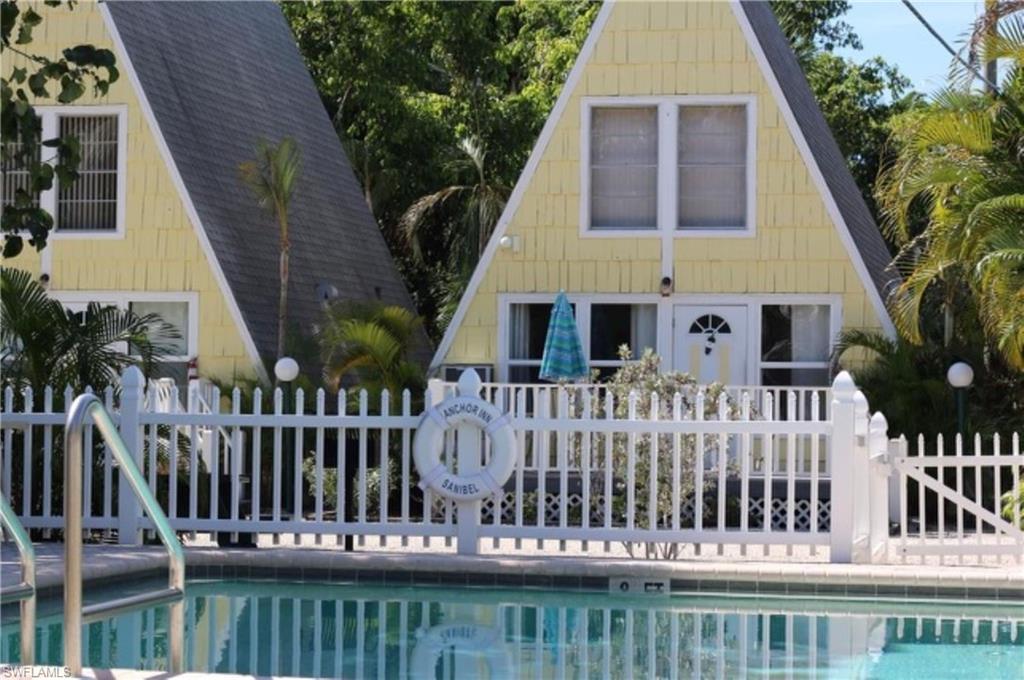 OVERVIEW: Rare investment opportunity to own a hotel with nightly rentals on Sanibel Island. Perfectly positioned investment location along the islands bike path and walking distance to beaches, shopping, dining establishments FEATURES: 12 nightly units and 1 managers cottage or possible monthly rental, each with private bathroom and kitchen. Efficiencies, studios, and three spacious A-frame cottages. 2.44-acres boasts spacious grounds, including a large pool, picnic areas, bike storage, ample parking, tranquil pond, office area, laundry facility and storage. VERSATILITY: Whether you envision a boutique hotel recreated within the existing footprint or redesigning for residential development, it offers the flexibility to explore both options. SANIBEL RARITY One of the few properties on Sanibel Island permitted for nightly rentals. VISIBILTY: located along the island's main road while benefiting from its set-back position, allows amble privacy. HIGHLIGHTS: Ideal visibility and located just under a mile from the beautiful white sandy beaches, this is an exceptional opportunity to create a unique hospitality experience. Don’t miss this chance to own a piece of Sanibel and transform this iconic 1959 motel into a sought-after boutique hotel.
