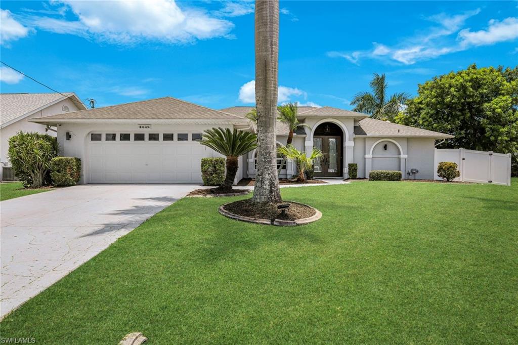 Welcome to this beautifully maintained 4-bedroom, 3-bathroom home located in the highly desirable Rose Garden & Tarpon Point area on Cape Coral's prestigious "Millionaires Row." While this home is surrounded by stunning waterfront, the home has never flooded and the homeowner only pays $800 *a year* for flood insurance! Situated on a private quarter-acre lot along a quiet road, this home offers the perfect blend of comfort, privacy, and Florida outdoor living. Designed with entertaining in mind, the split floor plan provides excellent separation for family and guests, while the fourth bedroom is huge, it can easily serve as a quiet home office. Inside, you'll find both formal and casual living rooms and dining rooms overlooking the pool, and four sets of sliding glass doors that flood the home with natural light and provide seamless access to the lanai. The kitchen features a Viking refrigerator, lots of counter space, a breakfast nook, and a breakfast bar all with pool views. Cabinetry is in excellent condition and can easily be painted to match your style without the expense of a full remodel. The primary suite offers private pool & lanai access through sliding glass doors, a walk-in closet, and an en-suite bath with dual sinks, abundant natural light, and brand-new shower glass. Step outside to your own private oasis featuring a huge heated pool, anti-mosquito screen enclosure, travertine pool deck, outdoor shower, and a true pool bathroom. Entertain with ease at the built-in outdoor island with quartz countertops and covered TV mount. The newly fenced backyard features a 6-foot solid privacy fence that is maintenance-free and moisture-resistant. Mature palm trees provide shade, while the refreshed landscaping offers a blank canvas for adding flowers, gardens, or additional trees. Enjoy exceptional privacy throughout the living areas with no direct views from neighboring homes and gulf-access waterways surrounding the area. Watch boats pass by from your dining room window and enjoy one of Cape Coral's most beautiful walkable neighborhoods, complete with sidewalks and easy access to Tarpon Point and Rotary Park.
Additional features include a laundry room with utility sink and cabinetry, side-yard access from the garage, and a split A/C system installed in the garage. Automatic shutters protect the patio with the touch of a button, while manual shutters provide coverage for the remainder of the home. Recent updates: New air-conditioner in 2025, new fence installed in 2025, new roof in 2021, pool pump replaced in 2021, and all are assessments paid!