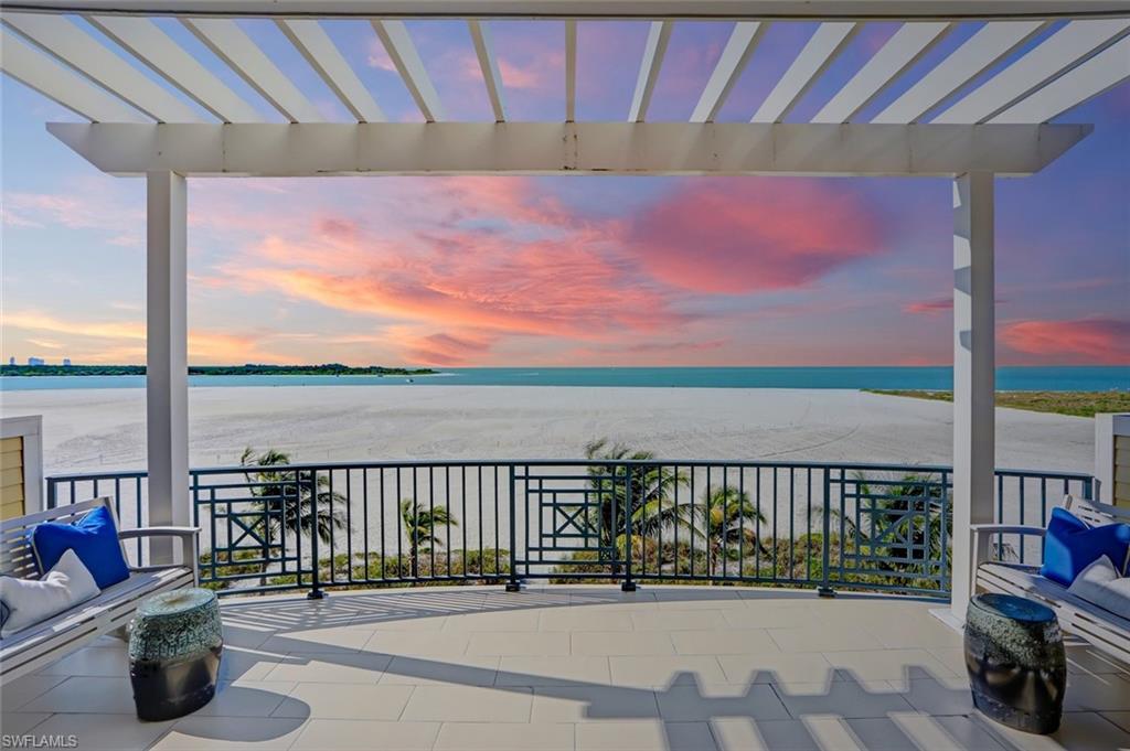 Direct-beachfront masterpiece, recently developed by highly regarded "Windover Development" & built by “Potter Homes,” with breathtaking Gulf views. Perfect rare location on the South tip of Estero Island, a stone’s throw to Lovers Key, with a deep stretch of sandy beach behind for unrivaled privacy. Coveted Southern exposure offers prime sun on the beachfront pool deck & picture-perfect sunsets with dolphins splashing & boats sailing through Big Carlos Pass. From the white oak hardwood floors & handcrafted light fixtures, to the warm beachy color palette, this home is TURNKEY with stunning designer furnishings/décor by Freestyle Interiors & is COMPLETELY MOVE-IN-READY. Fantastic open floor plan with spacious guest suites all with en-suite baths, dual master suites (one on main floor), gourmet kitchen with designer coastal finishes & ultra-private master wing with sitting areas & spa-like bath. Built to the newest codes, this recently built home includes storm impact glass doors/windows, private elevator, surround sound system, smart home technology, electric automated screens & window treatments, metal roof & all newer systems/equipment. This Fort Myers Beach gem will not last.