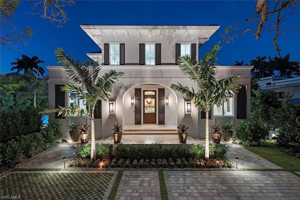 VIV Homes presents a new classic Floridian style home situated on a beautiful and quiet Mahogany tree lined street, right in the heart of Old Naples.  Perfectly positioned just 6 homes from the beach this residence stands on a sizable lot with rear alley access and affords easy walkability to 5th Ave South world class amenities. Encompassing over 6,200 square feet of air conditioned space, this 5 bedroom plus study home is a remarkable opportunity that offers an unrivaled level of quality along with a stunning outdoor living space including a substantial southwesterly exposed pool/spa, full outdoor kitchen, and a large covered living area protected by automated screens and shutters.  Residence emphasizes full concrete construction, open great room floor plan, Legno Bastone French White Oak wood flooring, gourmet kitchen with Sub-Zero/Wolf/Miele appliances complemented by bespoke cabinetry and an oversized cascading marble center island. Additional features include Sonos sound system, Lutron lighting, and security with cameras.